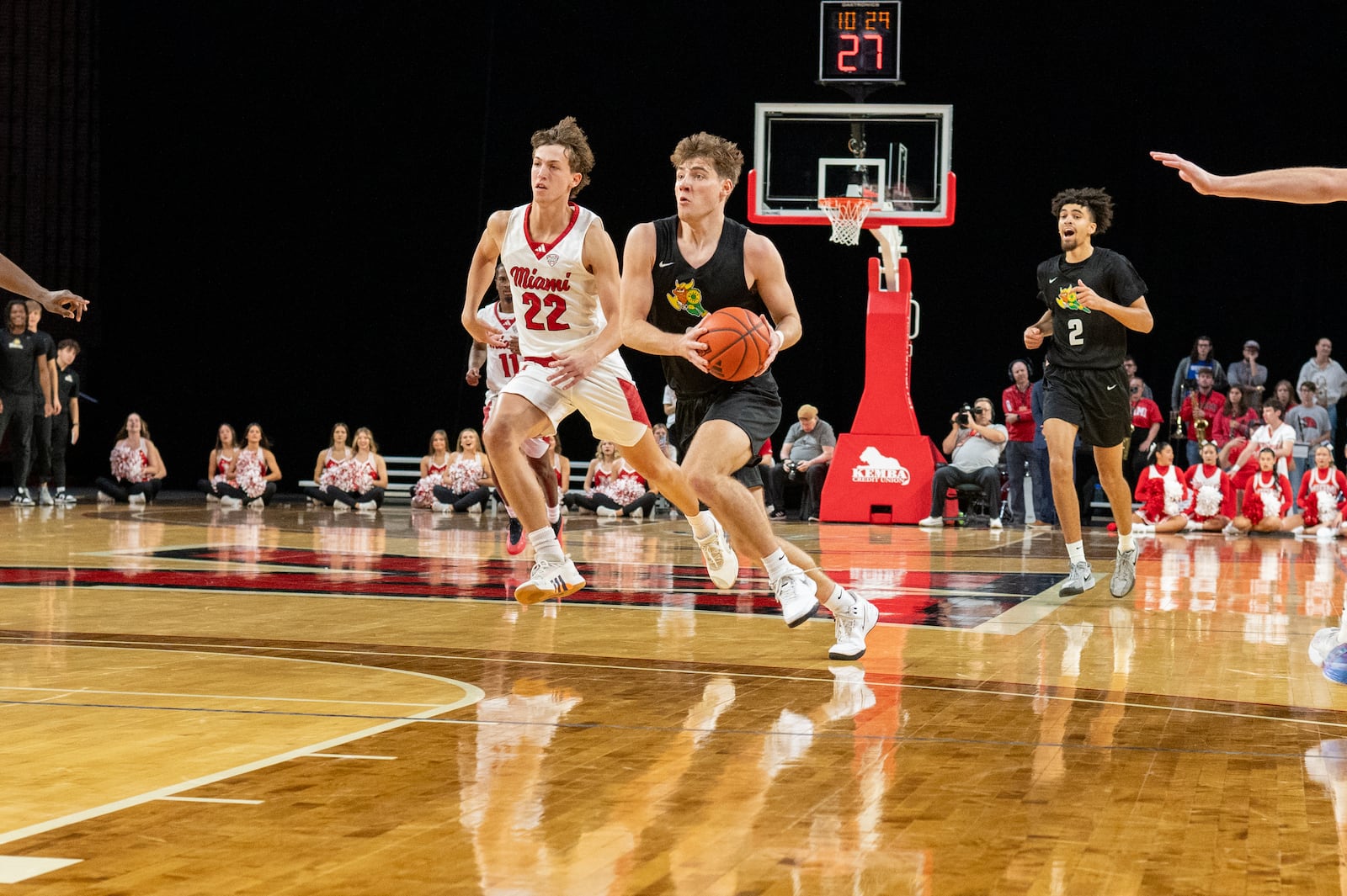 Wright State's Alex Huibregtse drives past Miami's Brant Byers during Saturday's game at Millett Hall. Wright State Athletics photo