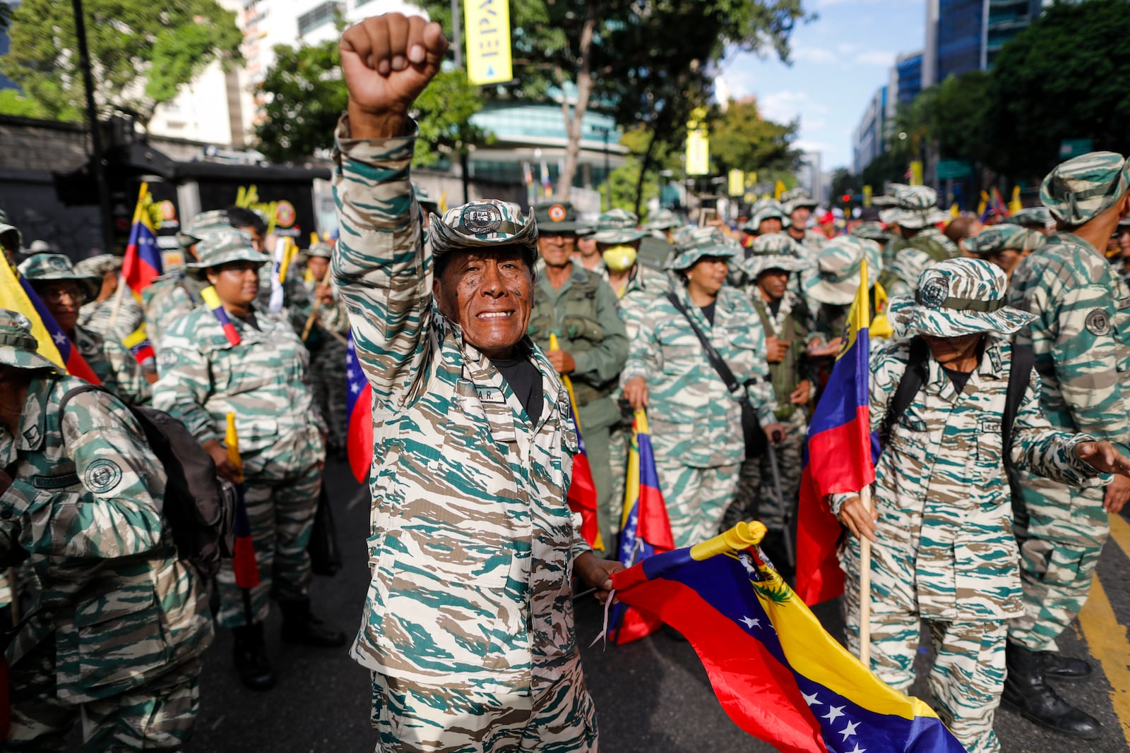 Government-backed militias march in Caracas, Venezuela, Thursday, Jan. 9, 2025, the day before President Nicolas Maduro's inauguration for a third term. (AP Photo/Cristian Hernandez)