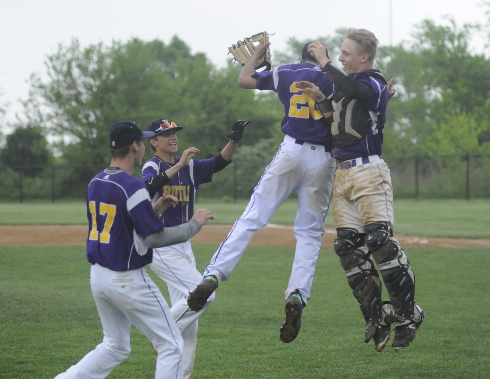 Butler reliever Quinton Hall (jumping, left) and catcher Boston Smith celebrate. Butler defeated Springboro 4-3 in a D-I high school baseball sectional final at Northmont on Thu., May 17, 2018. MARC PENDLETON / STAFF