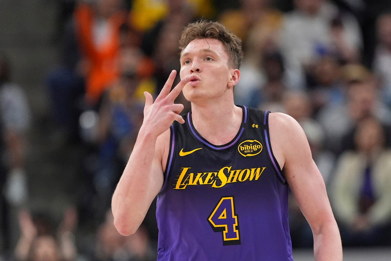 Los Angeles Lakers guard Dalton Knecht gestures after scoring during the second half of an NBA basketball game against the Los Angeles Clippers, Sunday, Jan. 19, 2025, in Inglewood, Calif. (AP Photo/Mark J. Terrill)