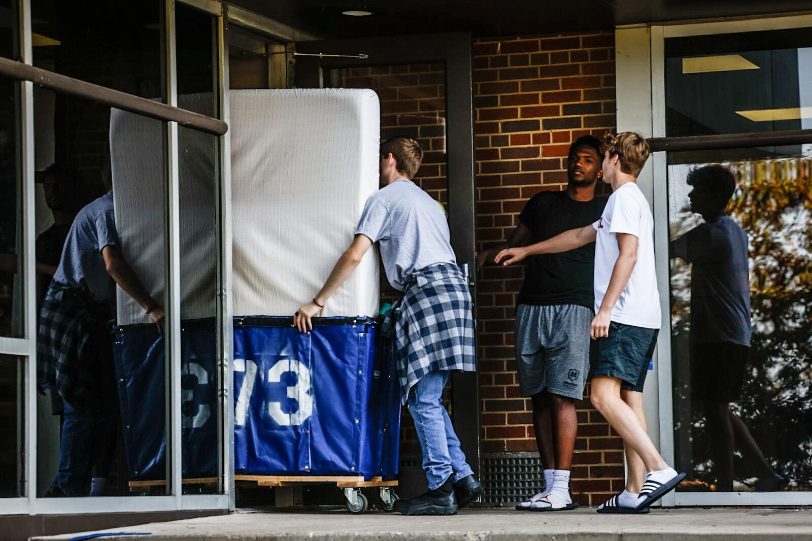 University of Dayton freshman move into Stuart Hall Friday August 18, 2023.  UD enrollment remains high this year, with more than 11,000 undergraduates, graduate, doctoral and law students. JIM NOELKER/STAFF