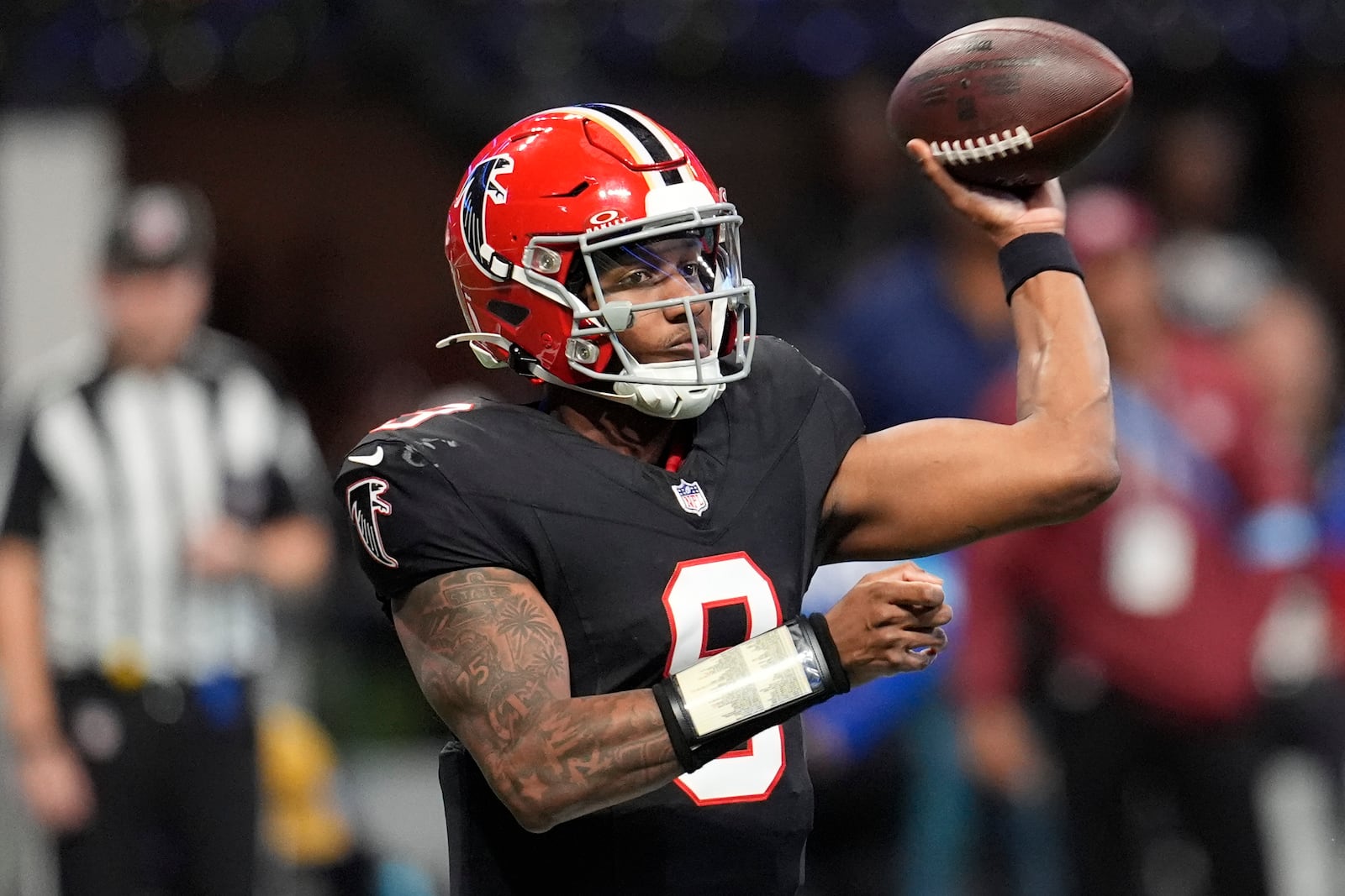 Atlanta Falcons quarterback Michael Penix Jr. (9) throws the ball in the second half of an NFL football game against the New York Giants in Atlanta, Sunday, Dec. 22, 2024. (AP Photo/Mike Stewart)