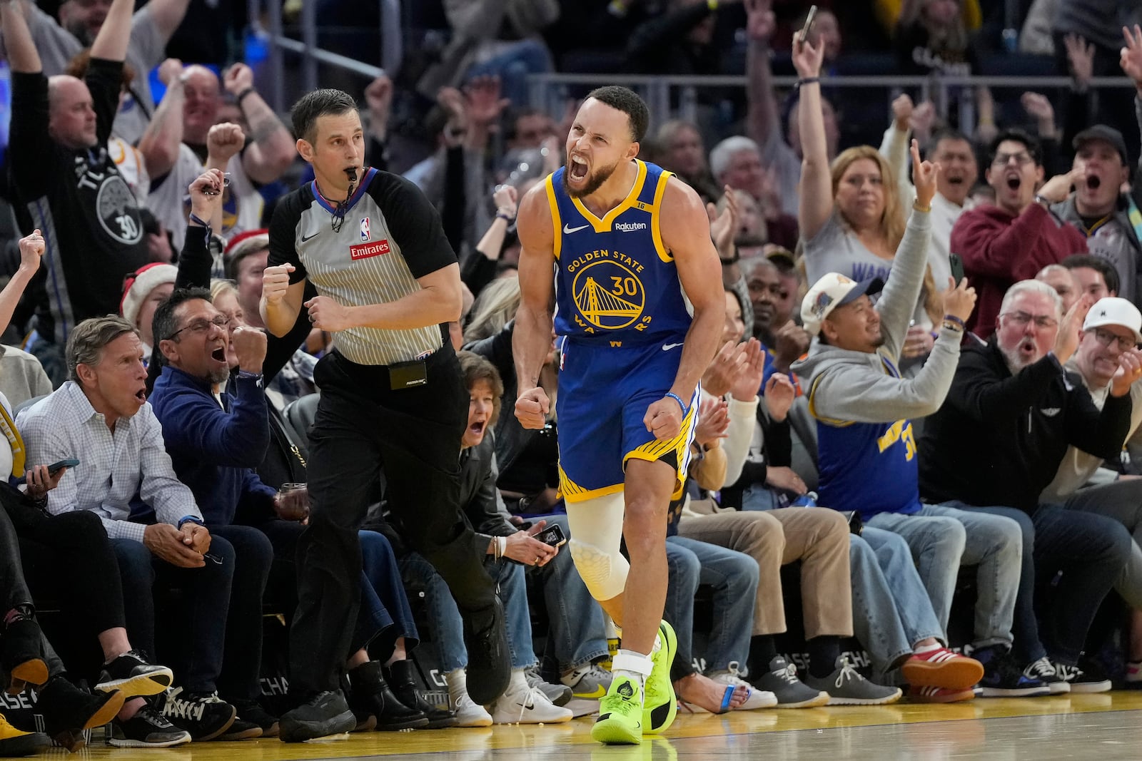 Golden State Warriors guard Stephen Curry (30) reacts after making a 3-point basket during the second half of an NBA basketball game against the Indiana Pacers in San Francisco, Monday, Dec. 23, 2024. (AP Photo/Jeff Chiu)