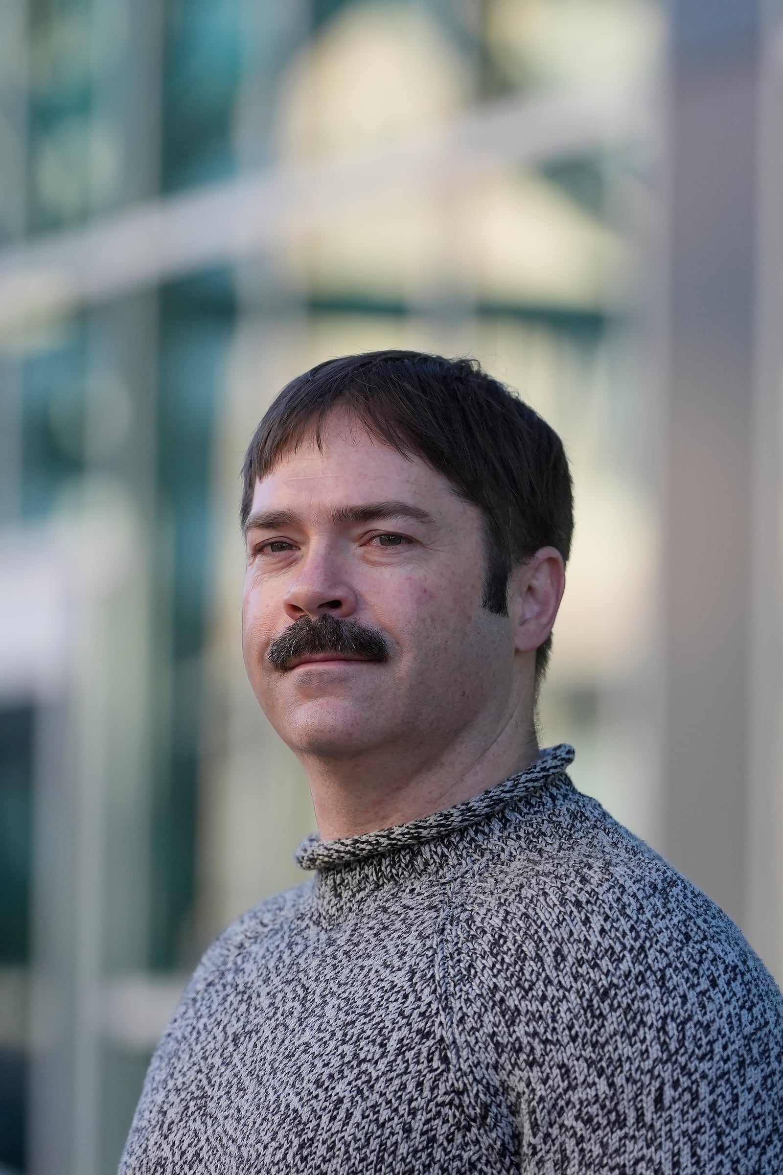 Jonah Paul, Digital Marketing Analyst at Employment Development Department, stands for photographs at the Jack London Square Amtrak Train station in Oakland, Calif., Friday, March 7, 2025. (AP Photo/Jeff Chiu)