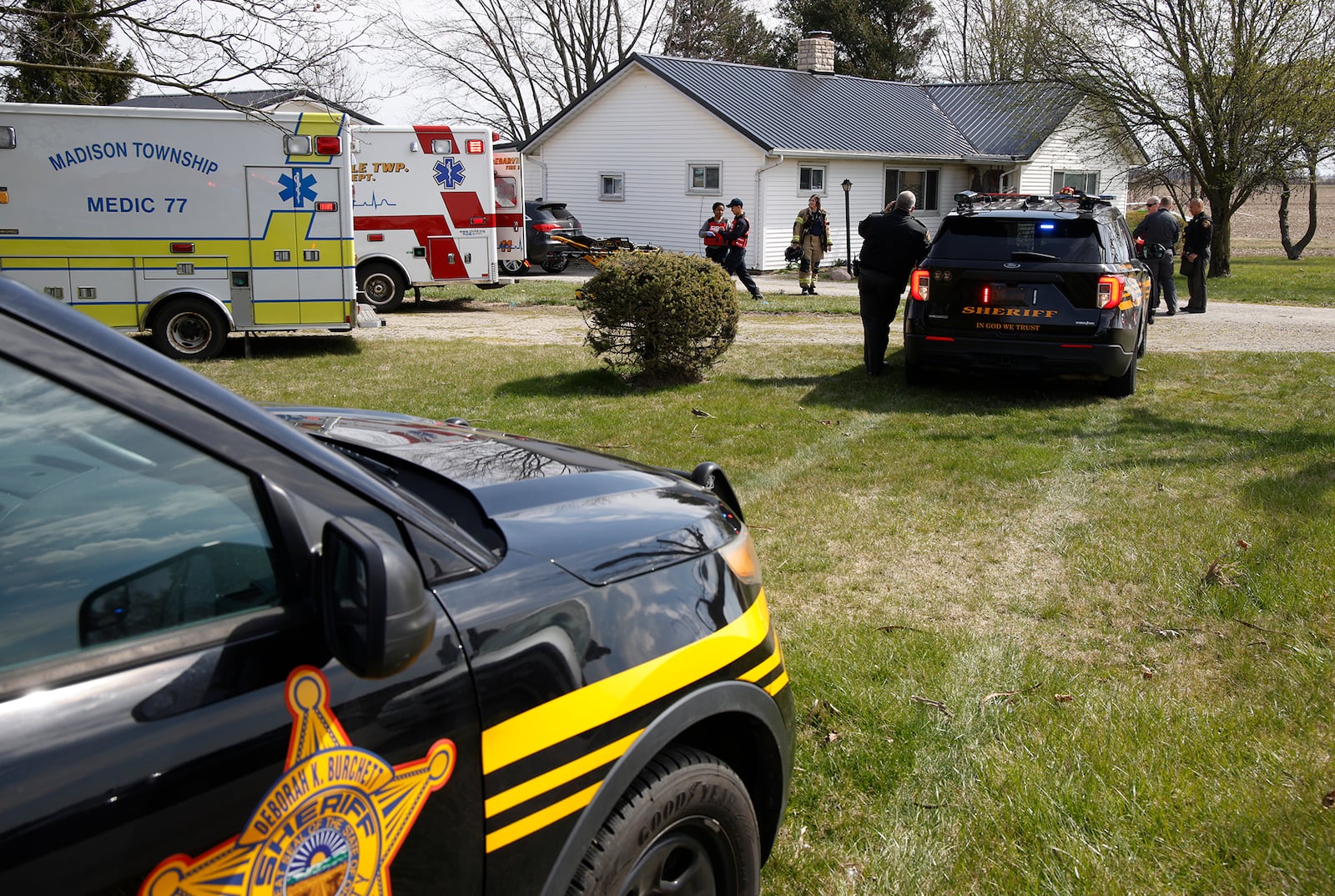 The Clark County Sheriff's Office investigates a shooting at a home in the 7000 block of South Charleston-Clifton Road Monday, March 25, 2024. Deputies arrived at the home to find the a woman shot in the driveway and an 86-year-old man who had been assaulted. The woman was flown by MedFlight to Kettering Health Main Campus, where she later died, while the man was transported to the hospital by medic. BILL LACKEY/STAFF