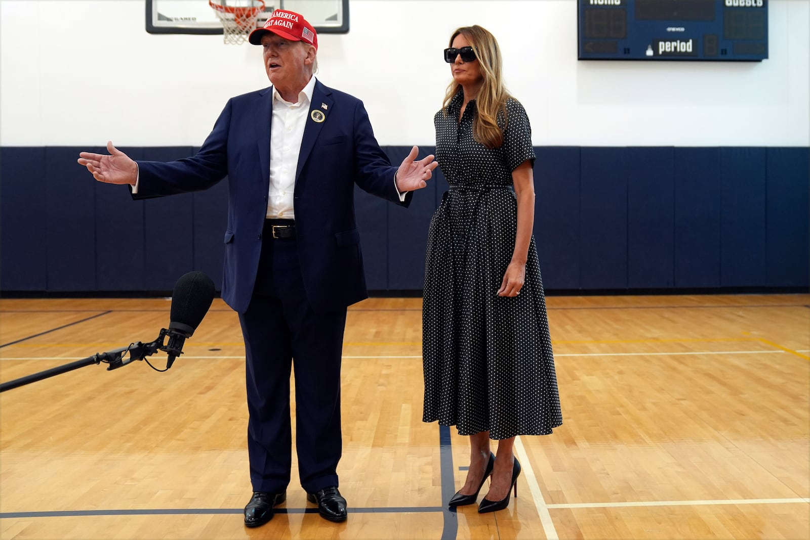 Republican presidential nominee former President Donald Trump speaks as former first lady Melania Trump listens after they voted on Election Day at the Morton and Barbara Mandel Recreation Center, Tuesday, Nov. 5, 2024, in Palm Beach, Fla. (AP Photo/Evan Vucci)