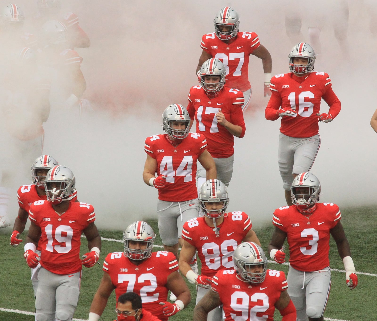 Ohio State players, including Ben Schmiesing (44), take the field before a game against Indiana on Saturday, Nov. 22, 2020, at Ohio Stadium in Columbus. David Jablonski/Staff