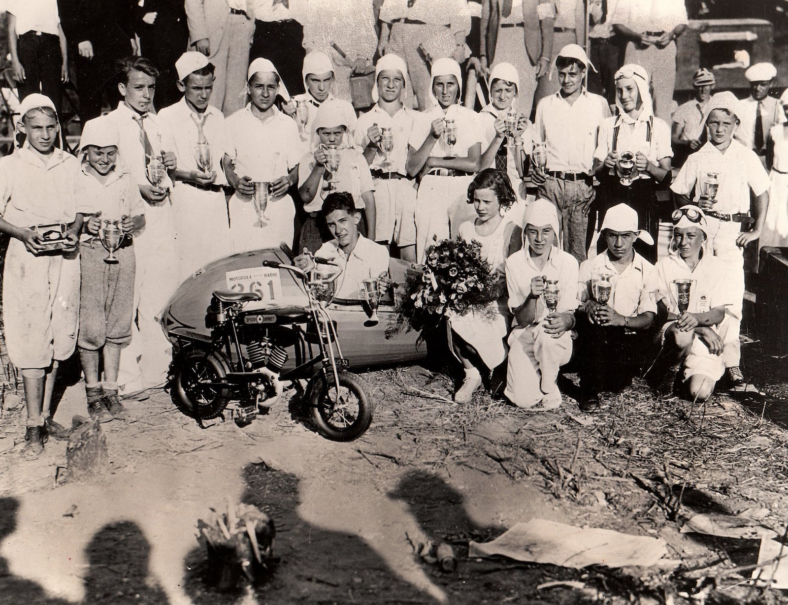 A photograph documents the winners of the first soap box derby held in Dayton in 1933. Seated in the derby car is Randall Custer, champion of the derby in the 11 to 16-year-old age range, next to him is Alice Johnson, the only girl who competed in the event and who took third place in the D-2 classification. David Wyse, winner of the boys up to 11-years-old is seond from left in the back row. DAYTON DAILY NEWS ARCHIVE