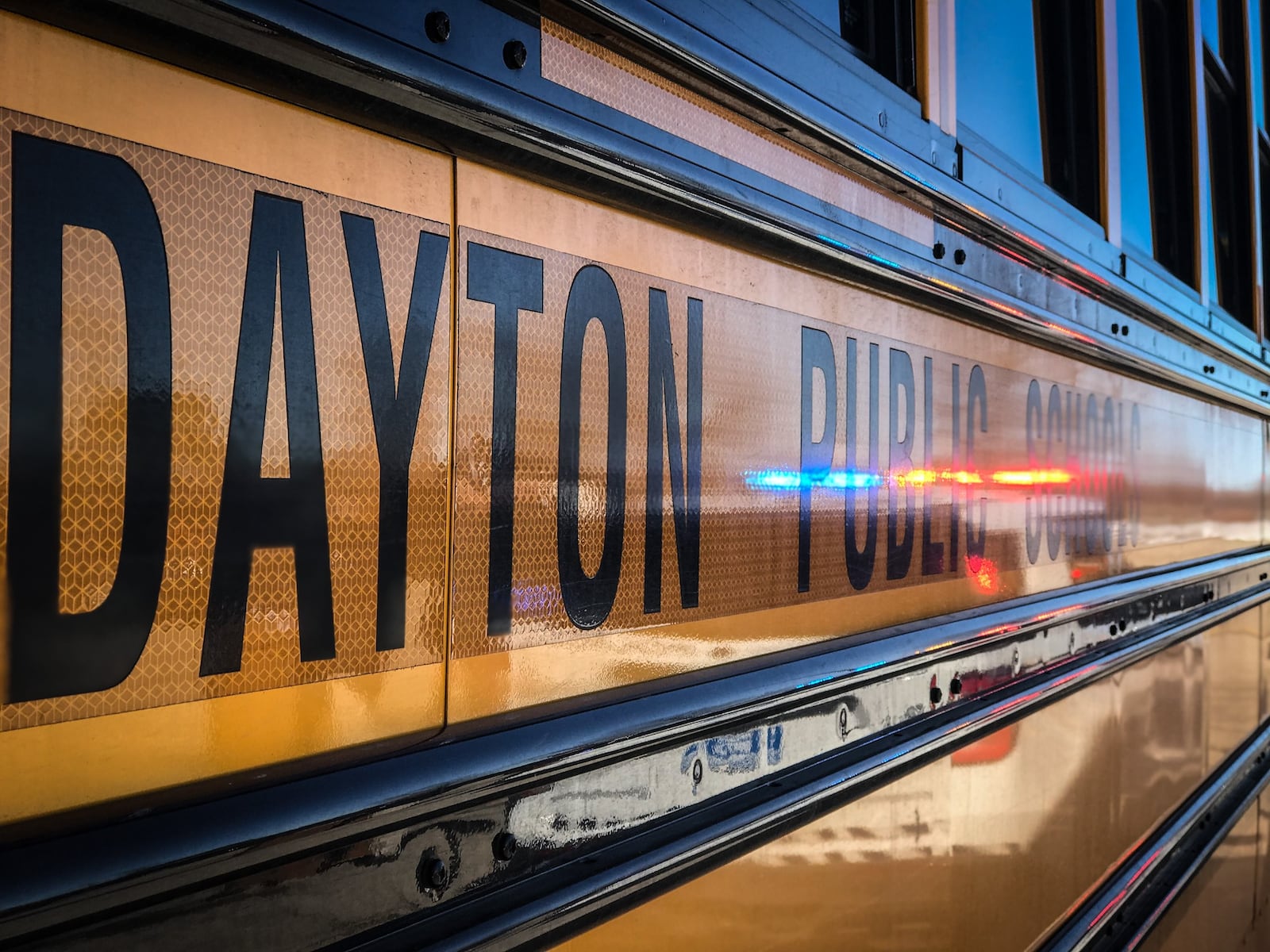 DPS Chief of Safety, Richard Wright II, left and Dayton Police Lt. James Mullins talked to the media Tuesday morning at Dunbar High School about Dayton students' return to in-person school next week.