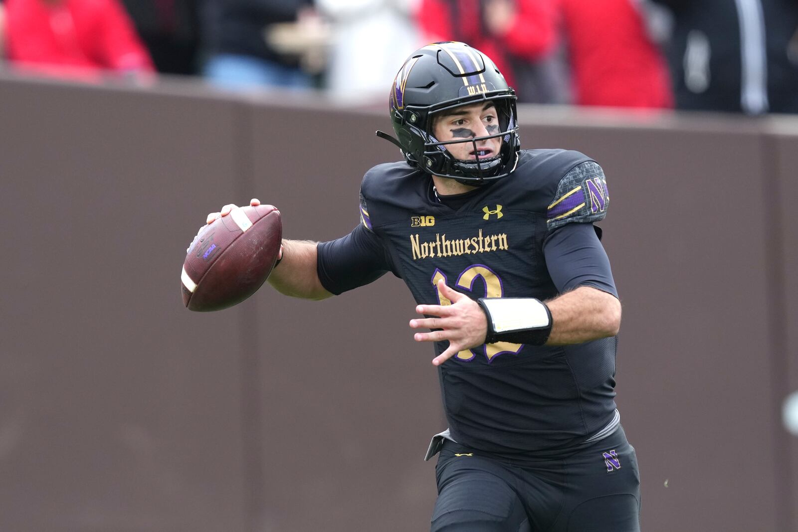 Northwestern quarterback Jack Lausch passes during the first half of an NCAA college football game against Ohio State at Wrigley Field on Saturday, Nov. 16, 2024, in Chicago. (AP Photo/Charles Rex Arbogast)