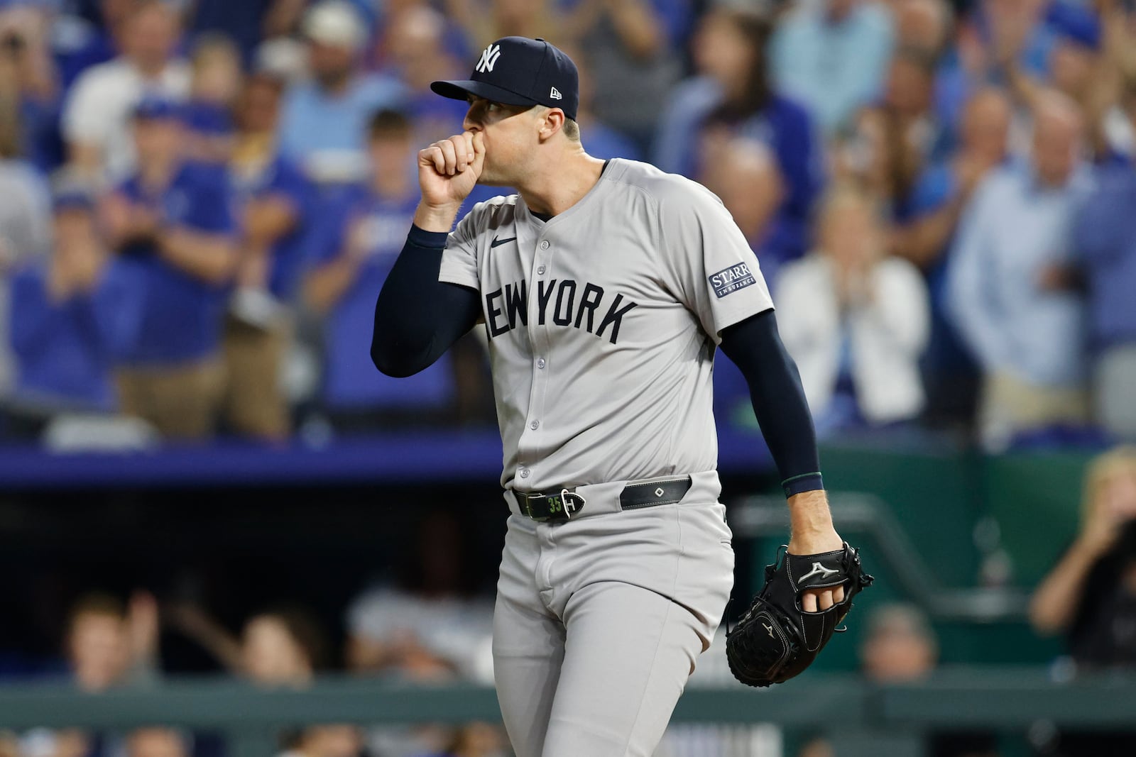 New York Yankees relief pitcher Clay Holmes pauses on the mound during the fifth inning in Game 3 of an American League Division baseball playoff series against the Kansas City Royals Wednesday, Oct. 9, 2024, in Kansas City, Mo. (AP Photo/Colin Braley)