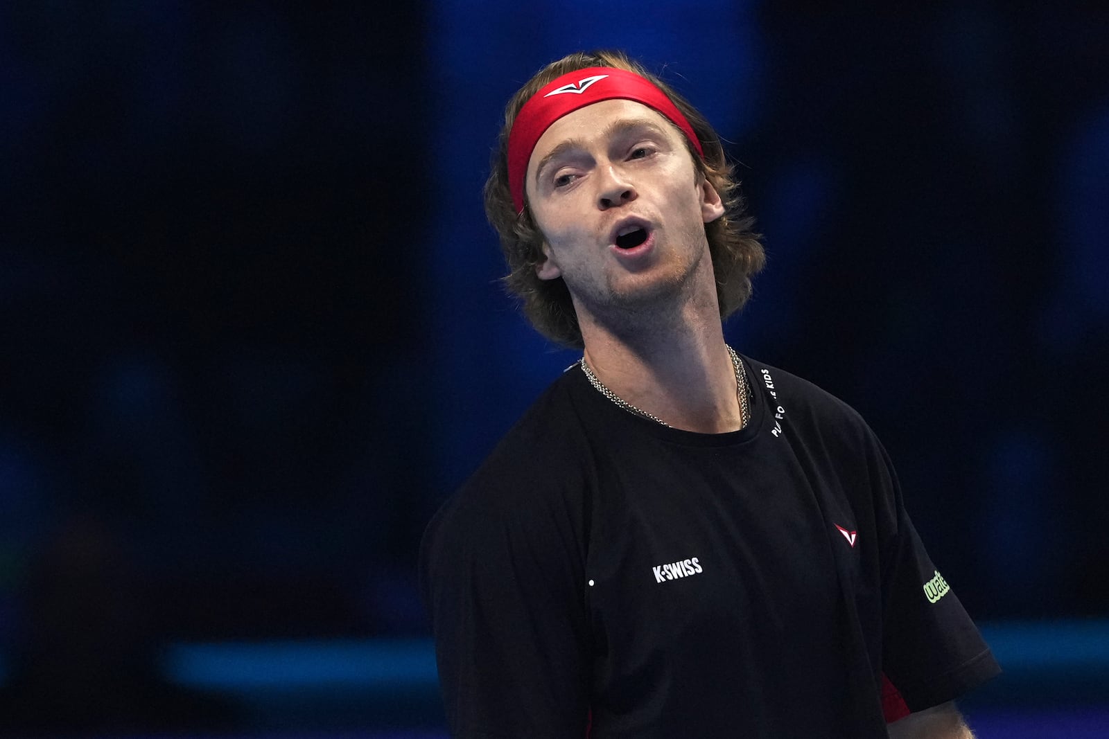 Russia's Andrey Rublev reacts during the singles tennis match of the ATP World Tour Finals against Norway's Casper Ruud, at the Inalpi Arena, in Turin, Italy, Friday, Nov. 15, 2024. (AP Photo/Antonio Calanni)