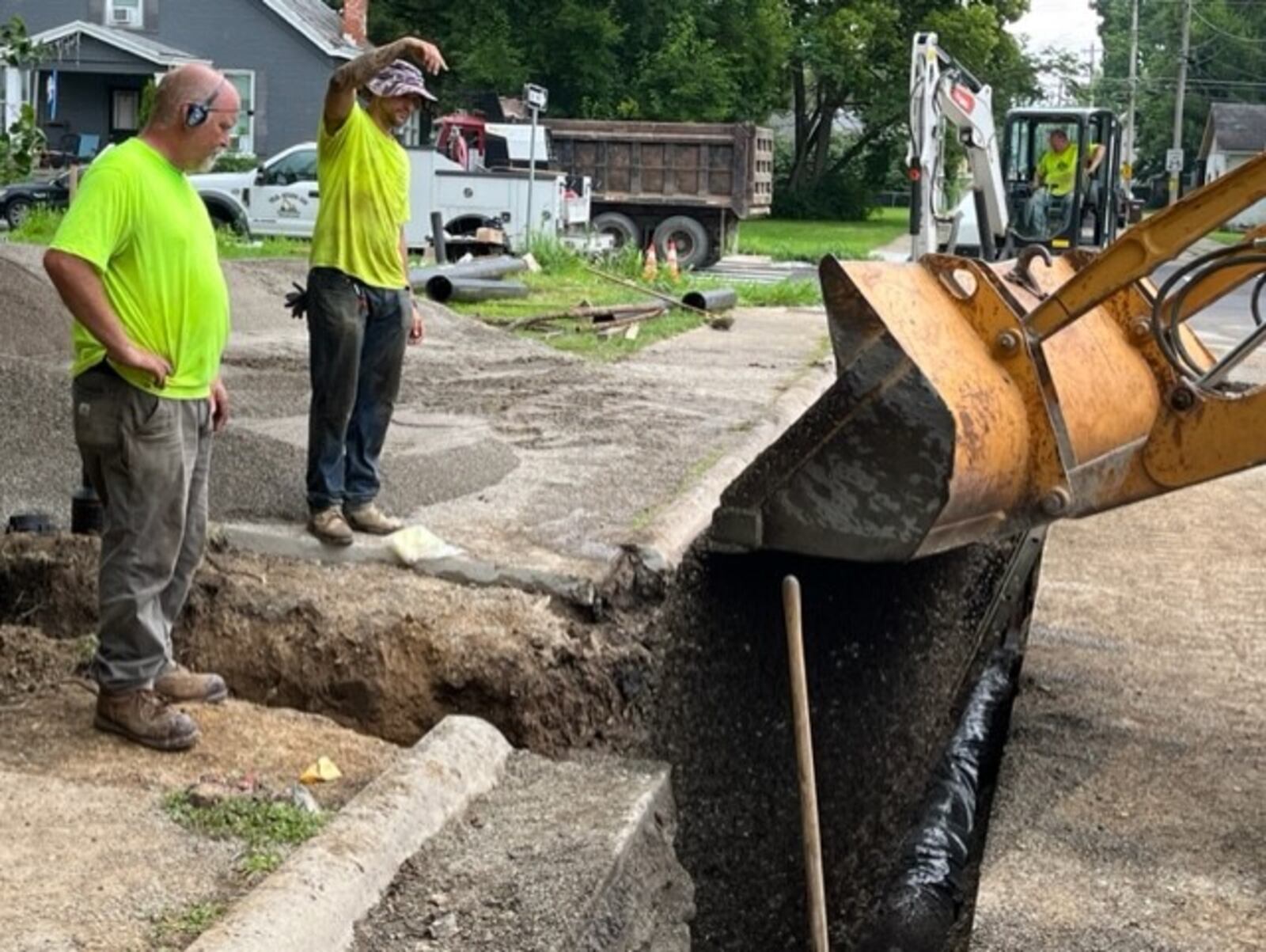 A crew with W.G. Stang installs a new water line on Pleasant Street in Lebanon.  ED RICHTER/STAFF