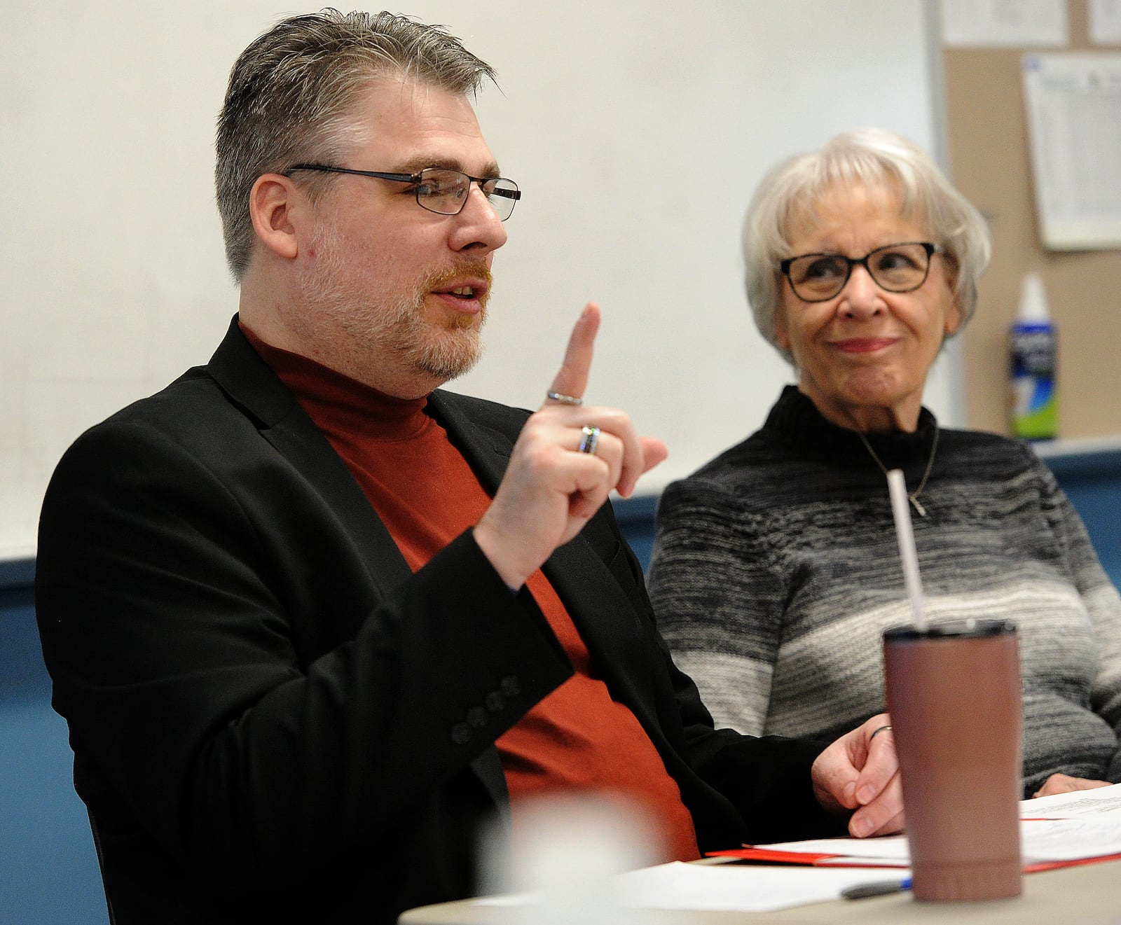 Evan Curtin of Springfield and his mother Peg Stephens talk to law enforcement about crisis training focused on mental health Thursday, March 16, 2023, at the Greene County Criminal Justice Academy. Deputies from Greene County and Clark County took part in a two-day training event, as did students in the justice program. MARSHALL GORBY\STAFF