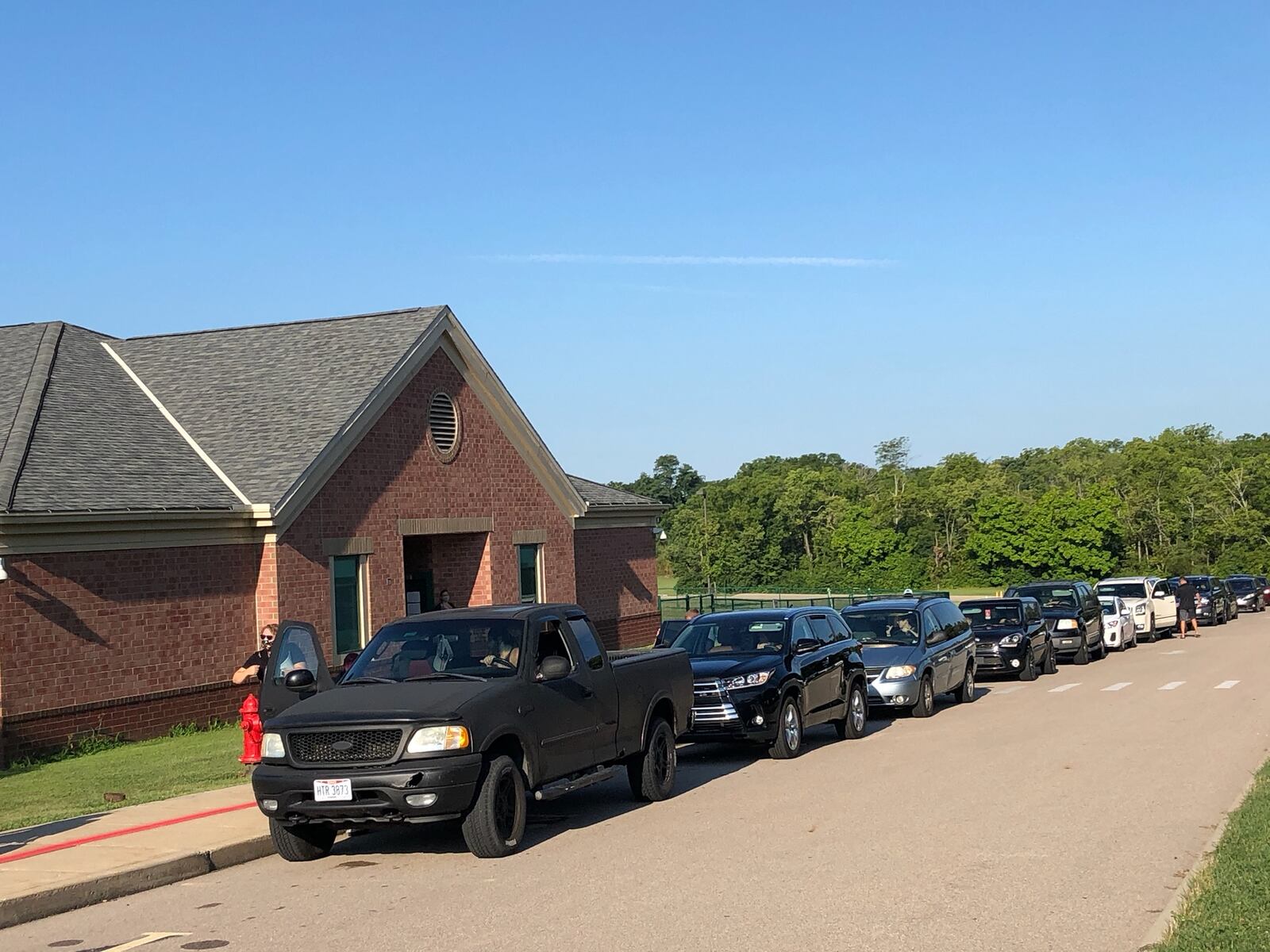 A long line of parents wait to drop off their students at Bowman Elementary School on the first day of school in the Lebanon school district.