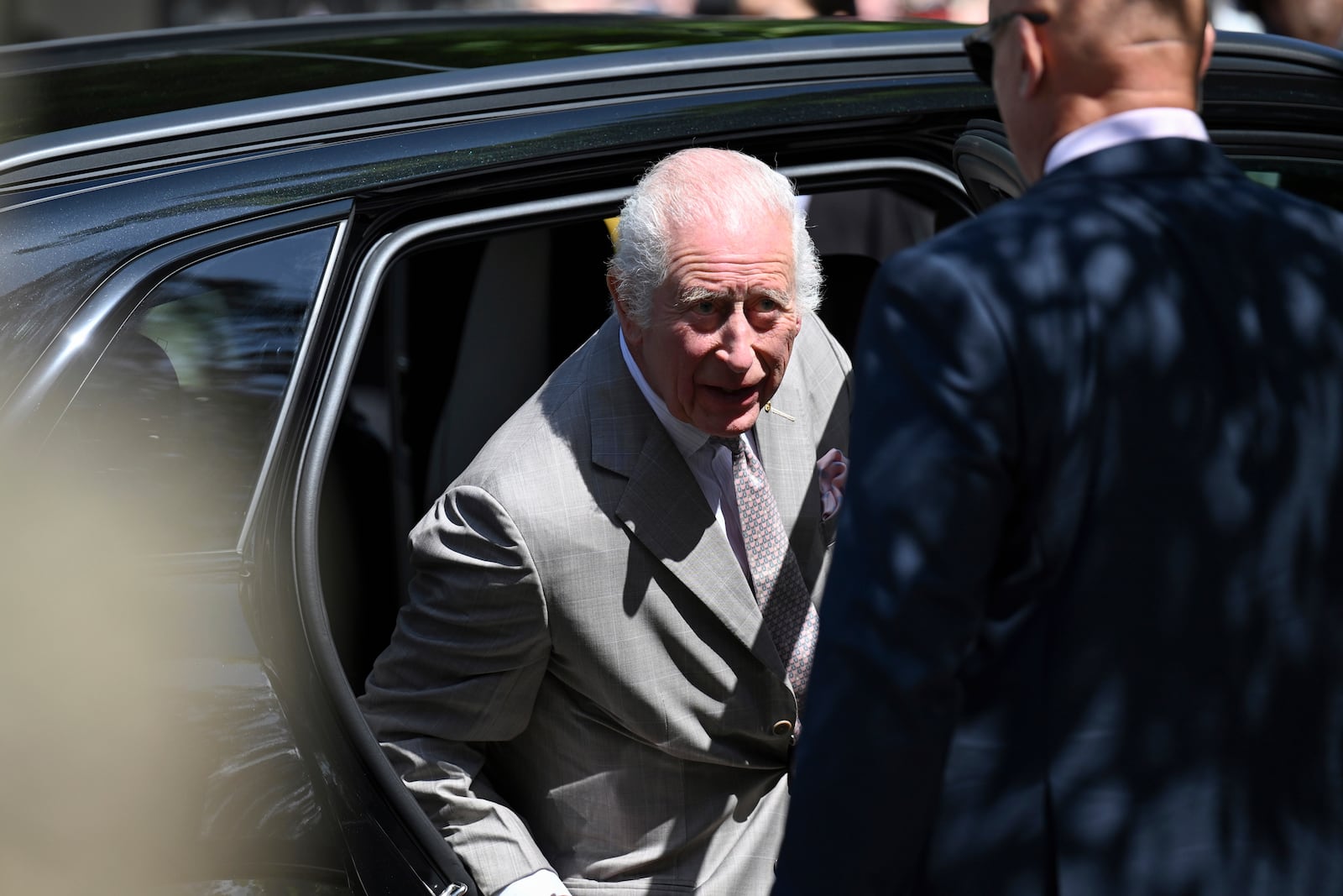 King Charles III exits a car as he arrives for a visit with Queen Camilla to St Thomas' Anglican Church in Sydney, Sunday, Oct. 20, 2024. (Dean Lewins/Pool Photo via AP)