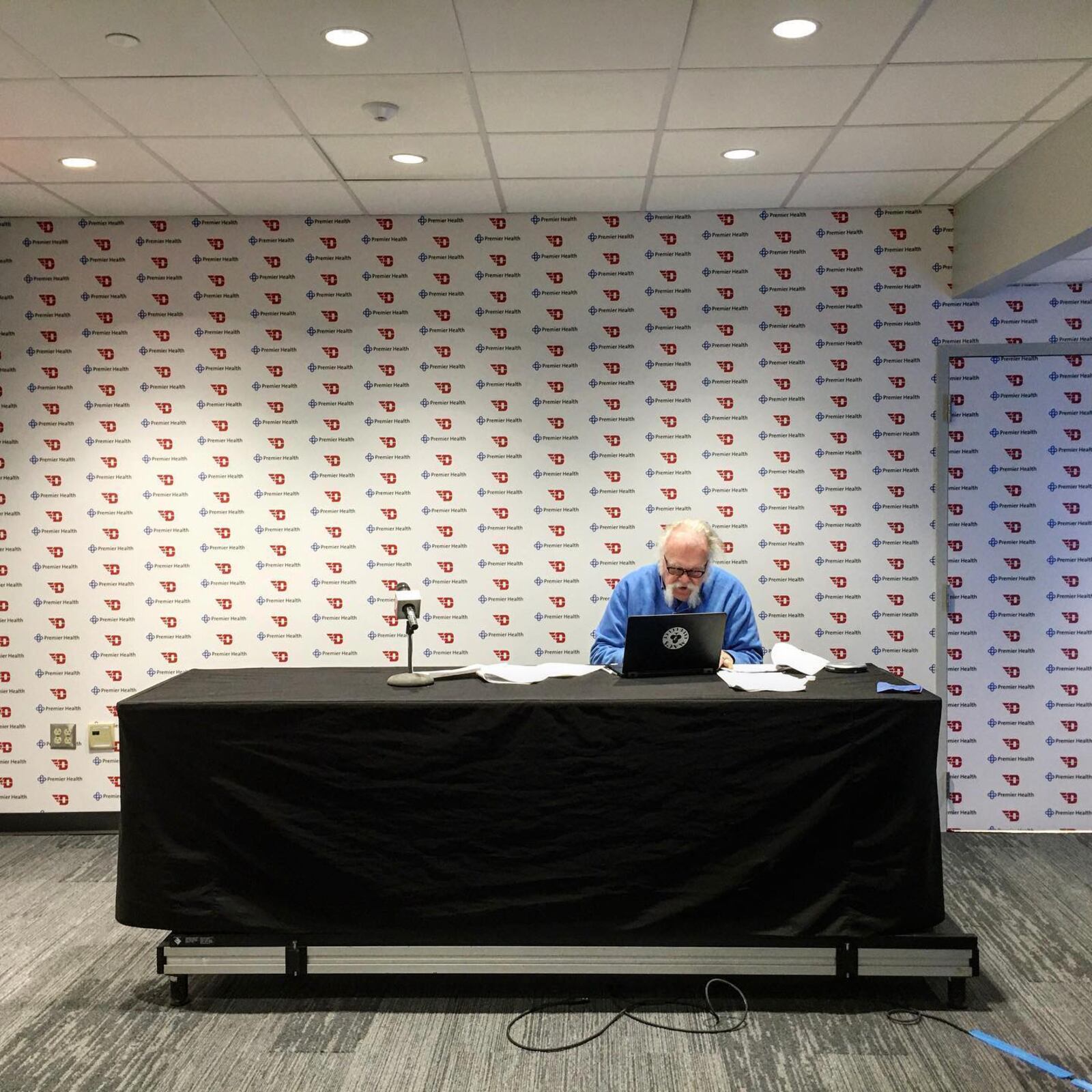 Tom Archdeacon works on a story at UD Arena after a Dayton Flyers men's basketball game on Nov. 10, 2019. David Jablonski/Staff