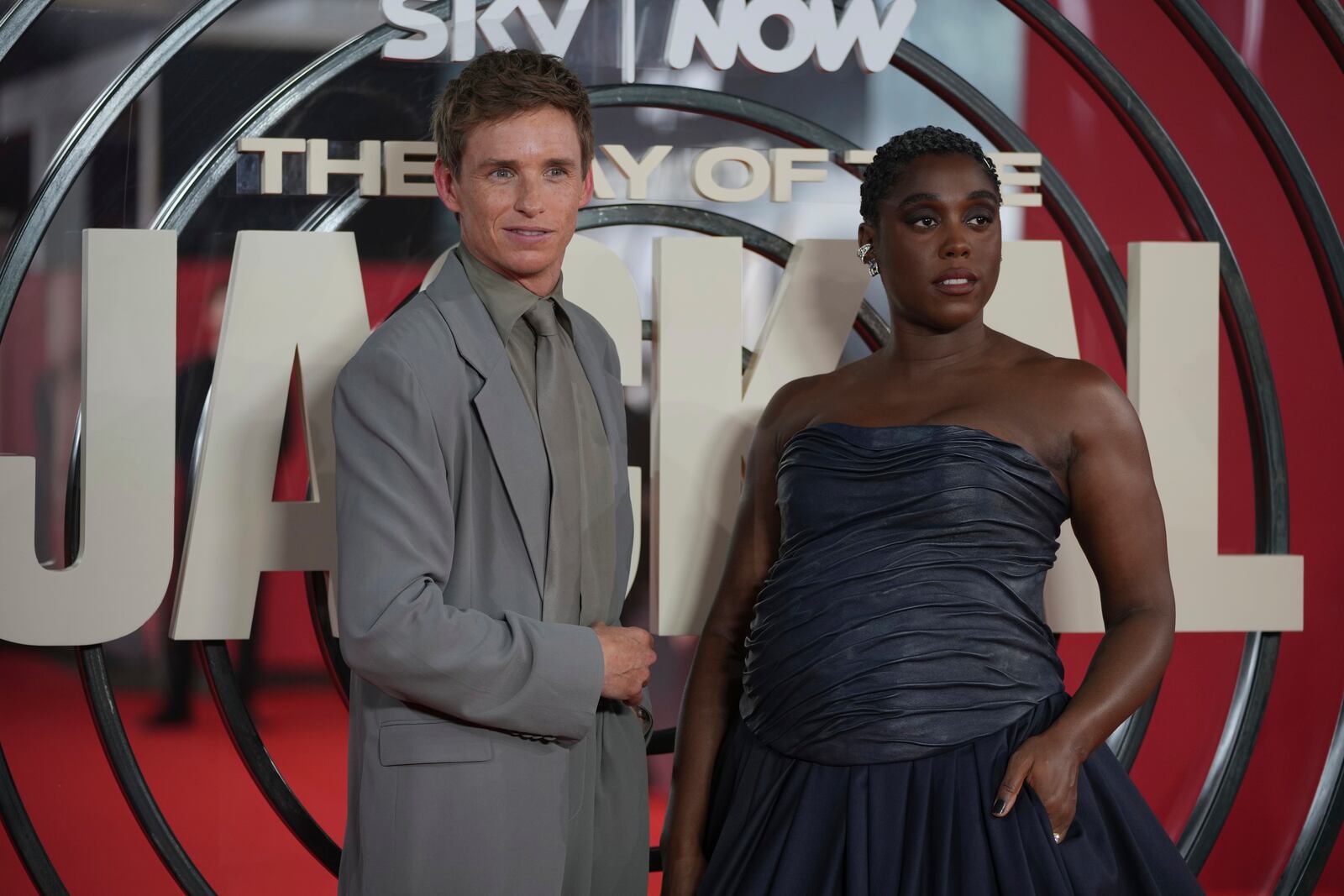 British actor Eddie Redmayne, left, and British actress Lashana Lynch pose for photos on the red carpet at the "The Day of the Jackal" premiere in London, Tuesday, Oct. 22, 2024. (AP Photo/Kin Cheung)