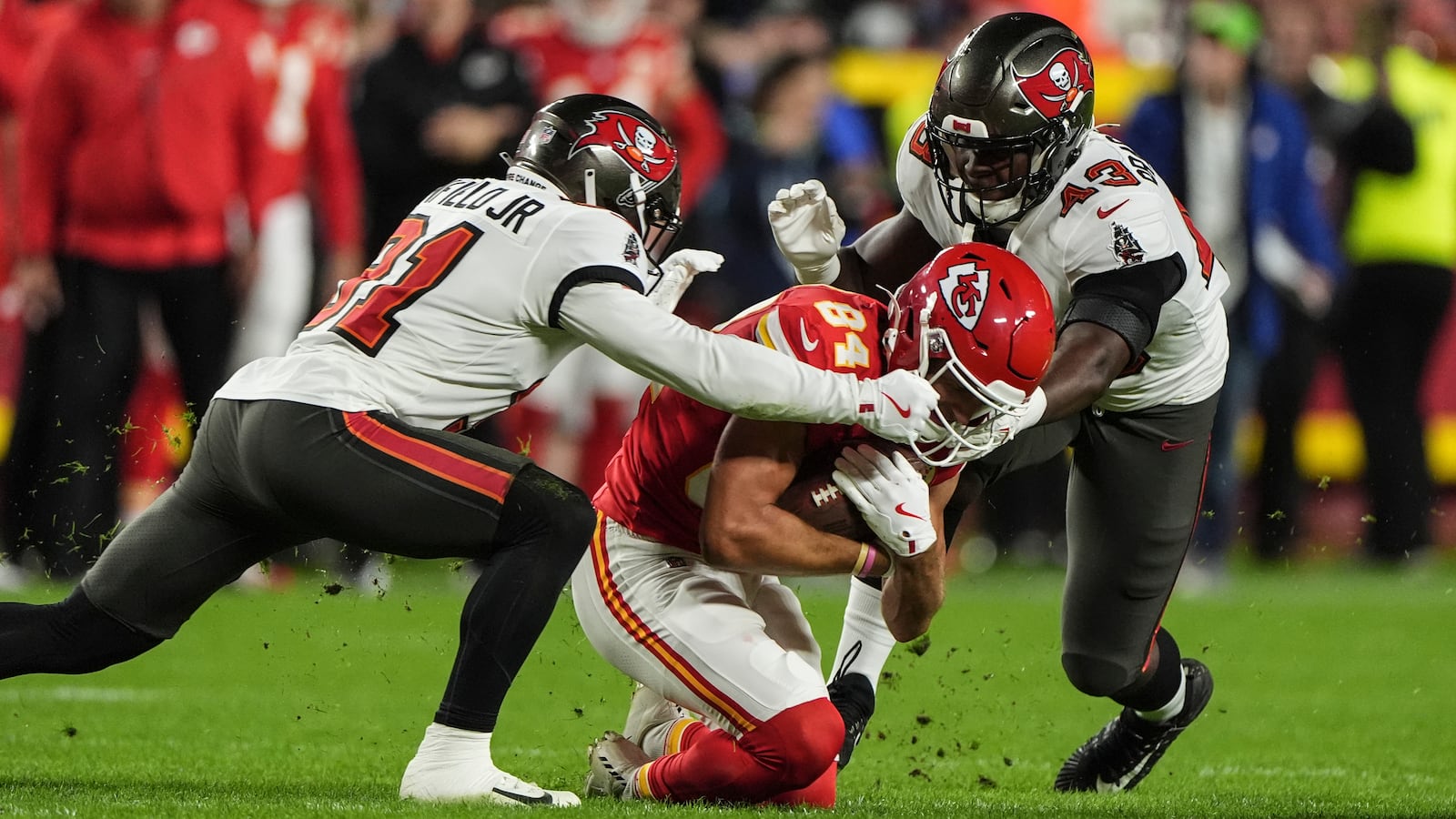 Kansas City Chiefs wide receiver Justin Watson (84) is hit by Tampa Bay Buccaneers linebacker Chris Braswell (43) during the first half of an NFL football game, Monday, Nov. 4, 2024, in Kansas City, Mo. (AP Photo/Charlie Riedel)