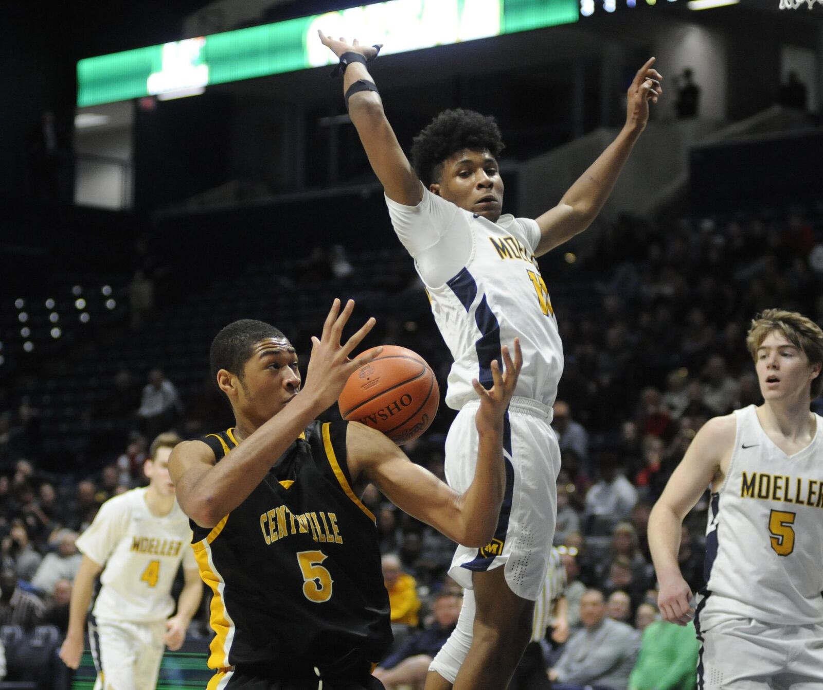 Centerville junior center Mo Njie (5) struggled throughout offensively. Moeller defeated Centerville 59-41 in a boys high school basketball D-I regional final at Xavier University’s Cintas Center on Saturday, March 16, 2019. MARC PENDLETON / STAFF