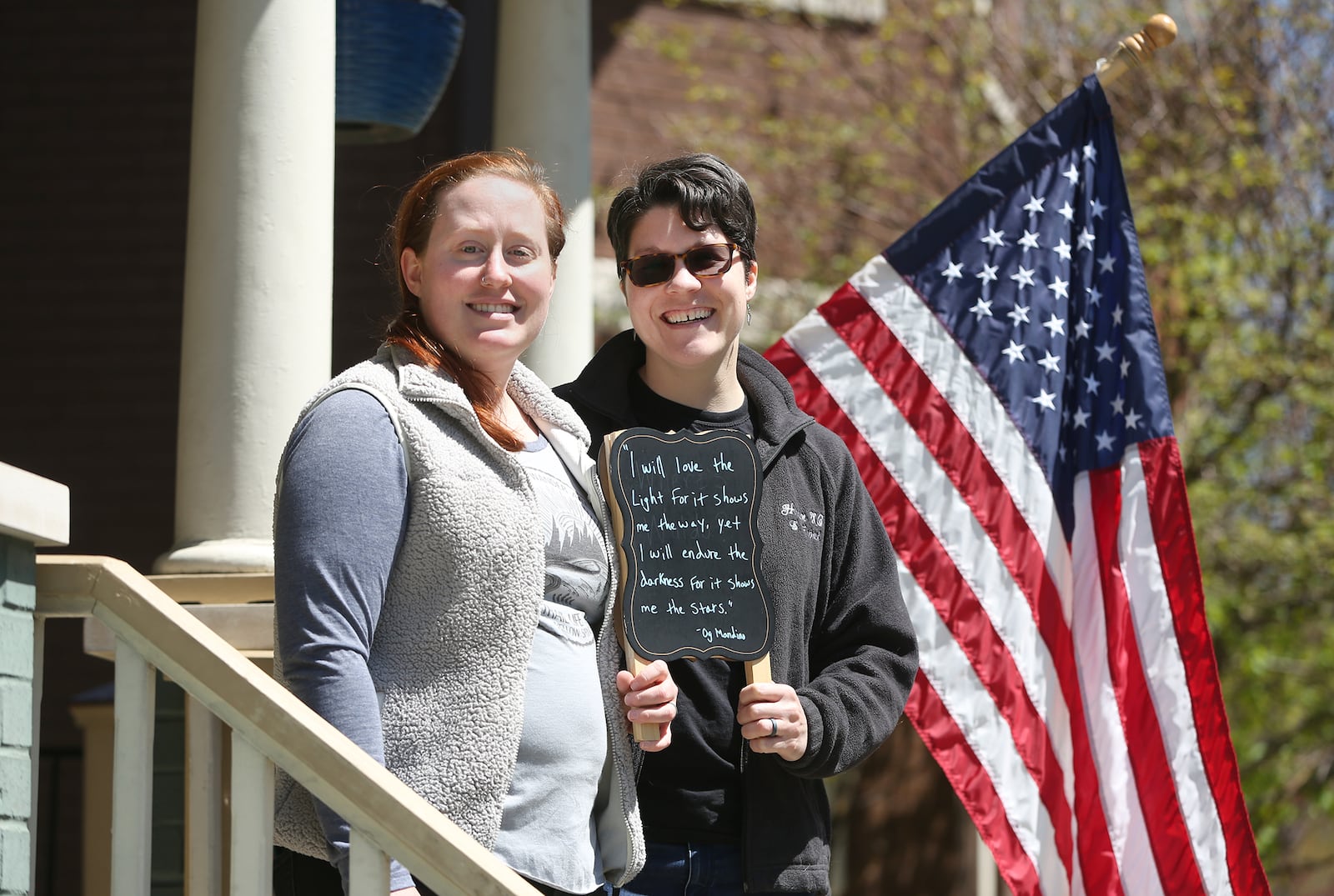 Katie Norris and Emmy Fabich have been leaving inspirational quotes on the porch of their home in Dayton’s McPherson Town Historic District for neighbors to find. LISA POWELL / STAFF