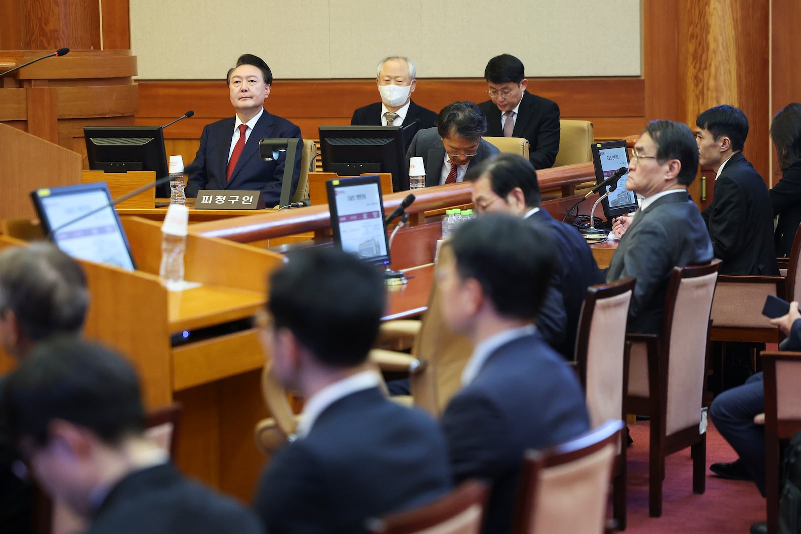 Impeached South Korean President Yoon Suk Yeol, top left, sits at his impeachment trial at the Constitutional Court in Seoul, South Korea, Tuesday, Jan. 21, 2025. (Kim Hong-Ji/Pool Photo via AP)