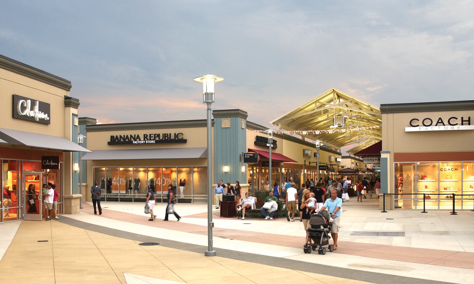 Shoppers walk around Cincinnati Premium Outlets in Monroe. A new report shows retail sales in the U.S. increased in May this year. CONTRIBUTED