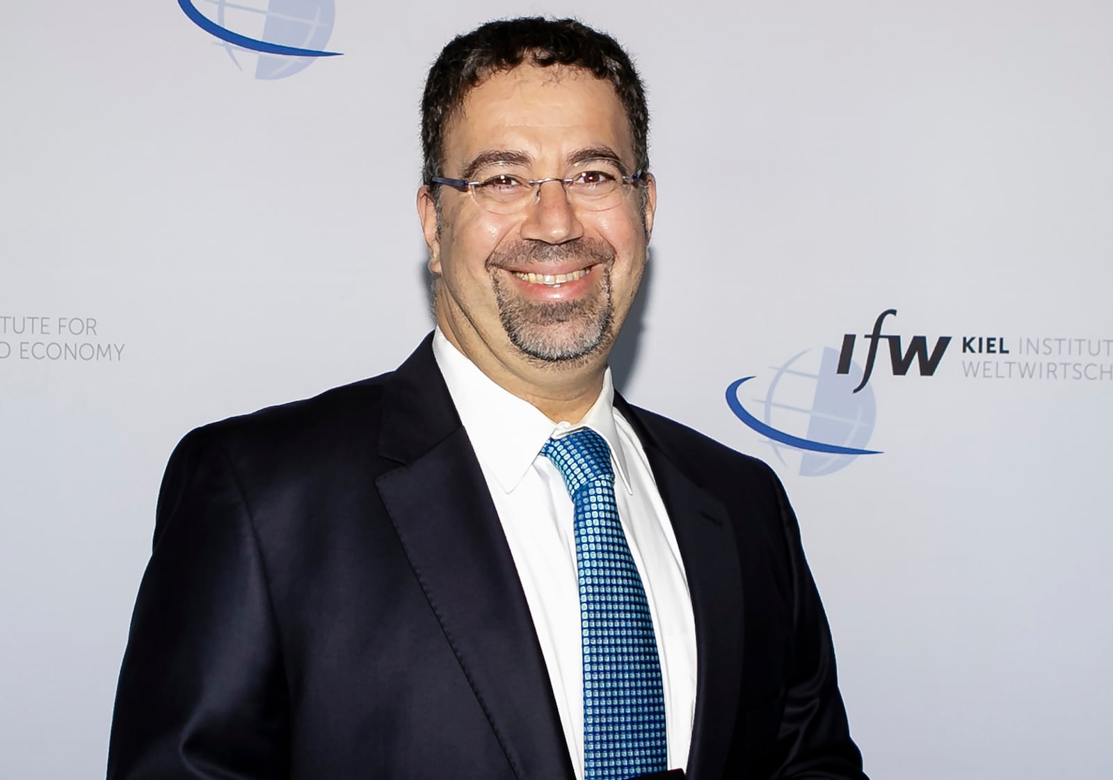 FILE - Daron Acemoglu of the Massachusetts Institute of Technology smiles in this image taken on June 22, 2019 in Kiel, Germany, as he and Simon Johnson and James A. Robinson won the Nobel prize in economics for research into reasons why some countries succeed and others fail. (Frank Molter, dpa via AP, File)