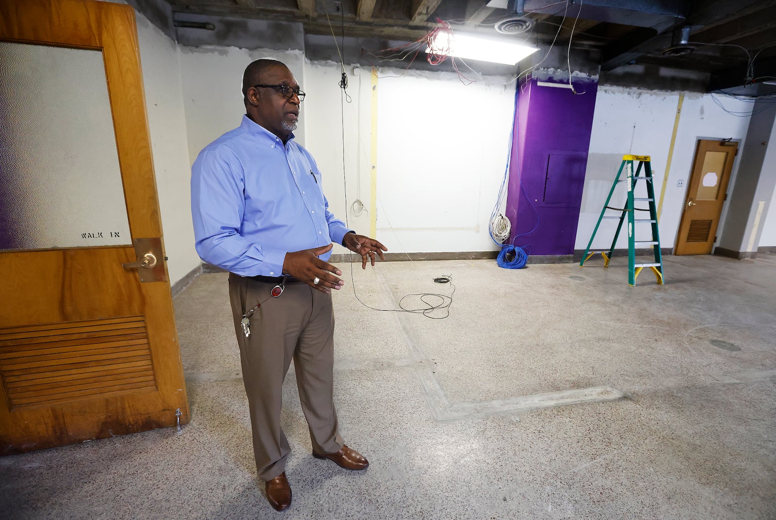 Dayton Business Technology School superintendent Don Jasmin stands in a space that will be renovated for the school's career technology services. Marshall Gorby / staff