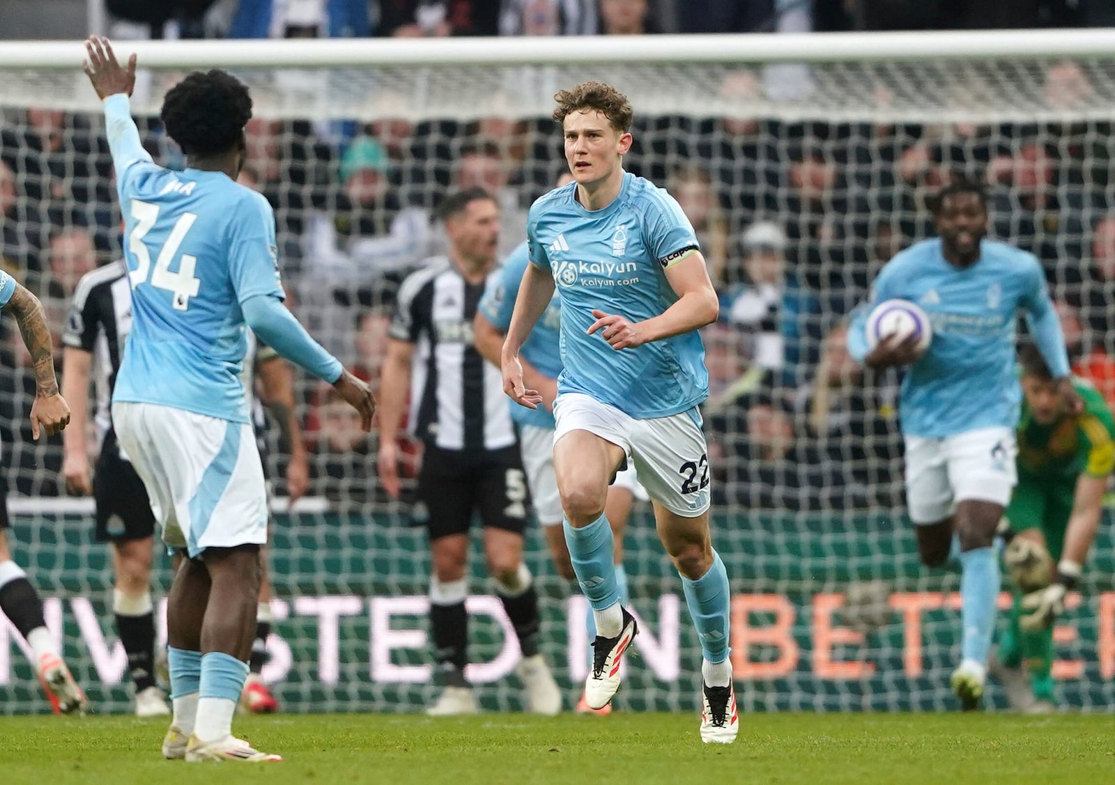 Nottingham Forest's Ryan Yates, center, after scoring during the English Premier League soccer match between Newcastle United and Nottingham Forest at St James' Park, Newcastle upon Tyne, England, Sunday, Feb. 23, 2025. (Owen Humphreys/PA via AP)