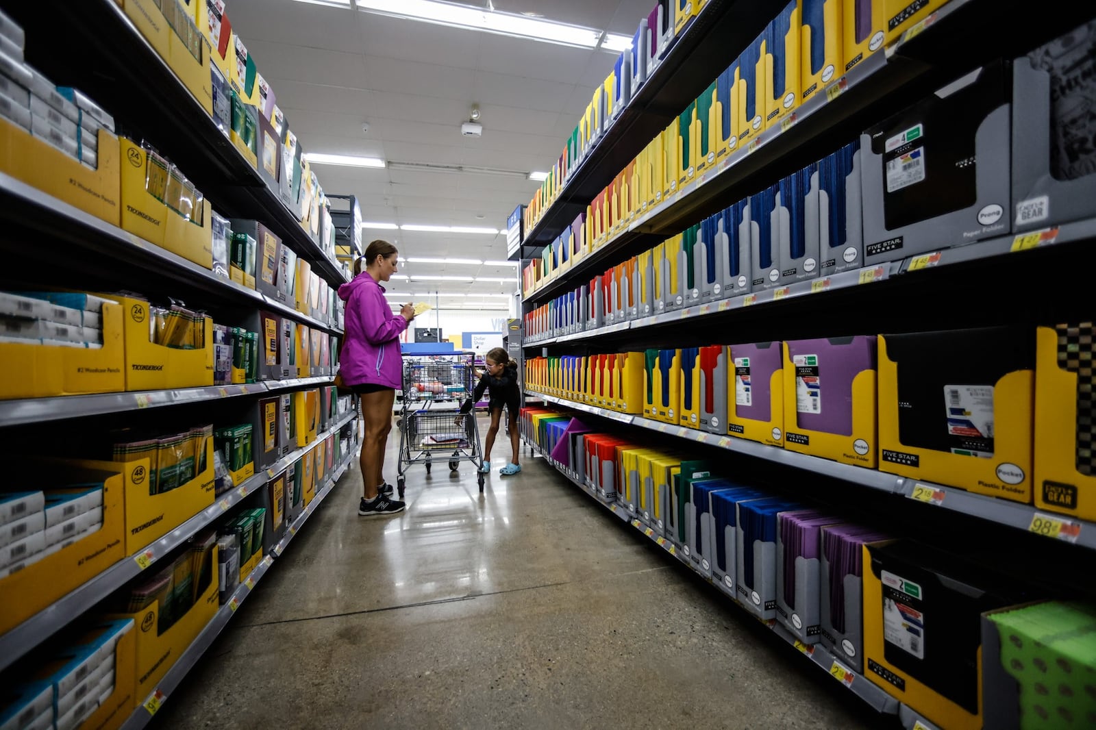 Kate Mossop and her daughter shop for school supplies at the Super Walmart on Wilmington Pike Thursday July 28, 2022. JIM NOELKER/STAFF