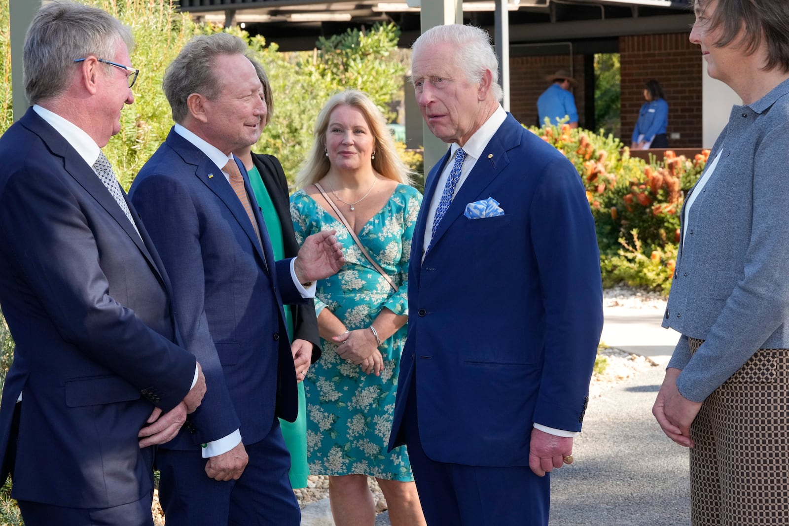 Britain's King Charles III, 2nd from right, talk with Australian Andrew Forrest, 2nd from left, before entering Australian National Botanic Gardens in Canberra, Monday, Oct. 21, 2024. (AP Photo/Mark Baker, Pool)