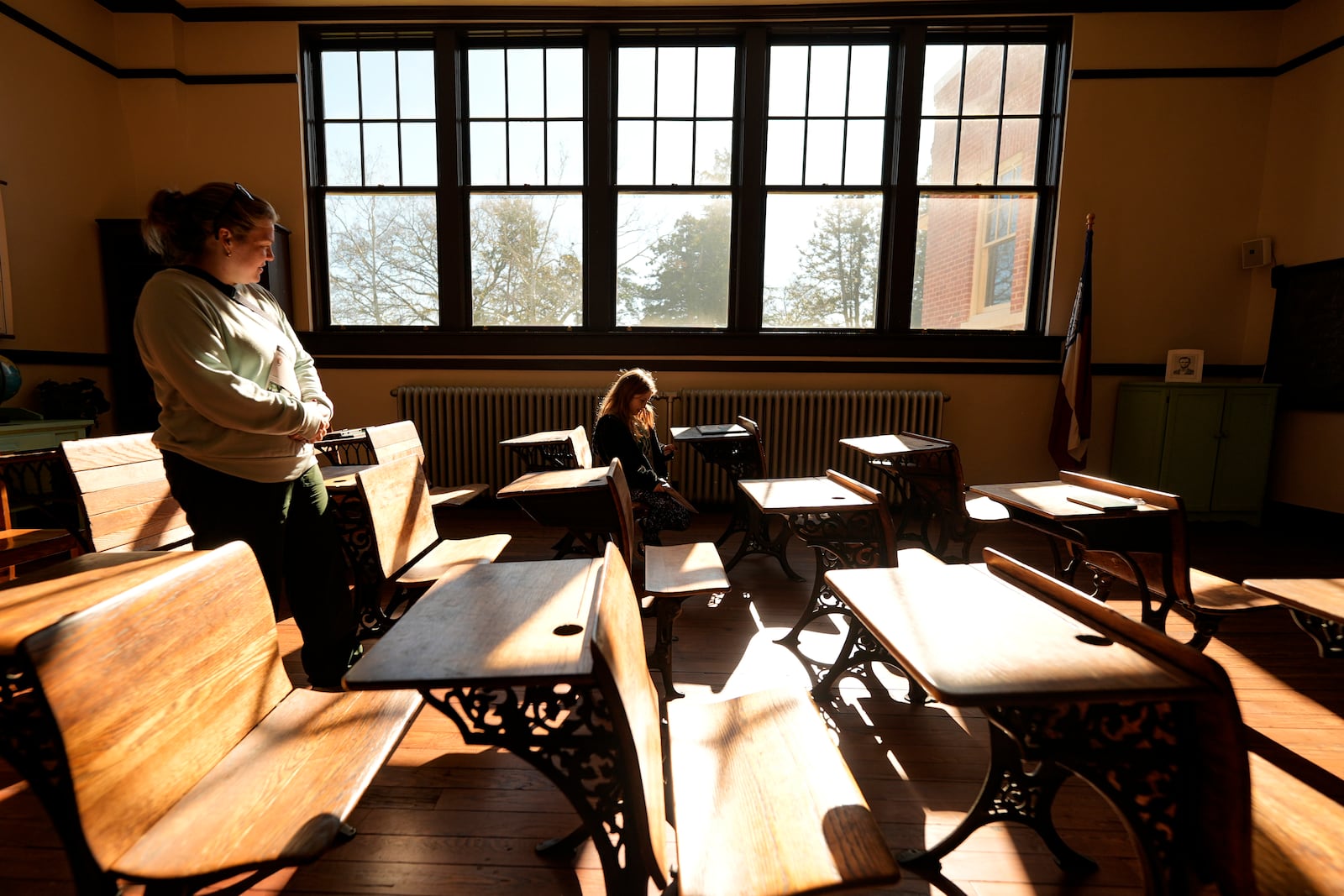 Gail Hassler and her mother Sara Hassler view a classroom inside the Jimmy Carter National Historical Park, Monday, Dec. 30, 2024, in Plains, Ga. Former President Carter died Sunday at the age of 100. (AP Photo/Mike Stewart)