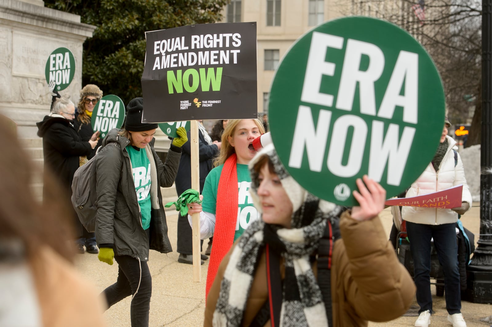 People hold a rally in front of the National Archives to highlight President Joe Biden's decision to declare the Equal Rights Amendment (ERA) as the 28th Amendment to the United States Constitution, Friday, Jan. 17, 2025, in Washington. (AP Photo/Rod Lamkey, Jr.)