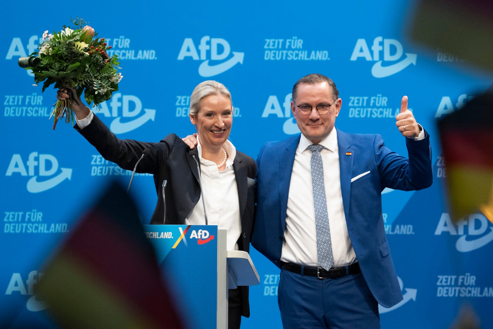 AfD national chairwoman Alice Weidel, left, and Tino Chrupalla, AfD national chairman and AfD parliamentary group leader, at the party's national convention in Riesa, Germany, Saturday, Jan. 11, 2025. (Sebastian Kahnert/dpa via AP)