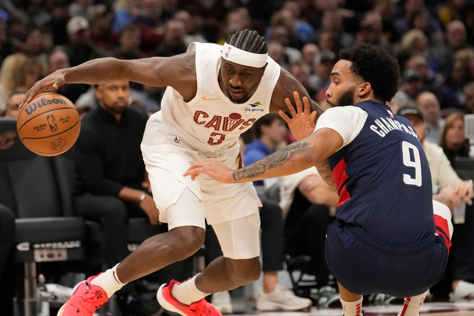 Cleveland Cavaliers guard Caris LeVert (3) drives against Washington Wizards forward Justin Champagnie (9) in the first half of an NBA basketball game, Friday, Dec. 13, 2024, in Cleveland. (AP Photo/Sue Ogrocki)