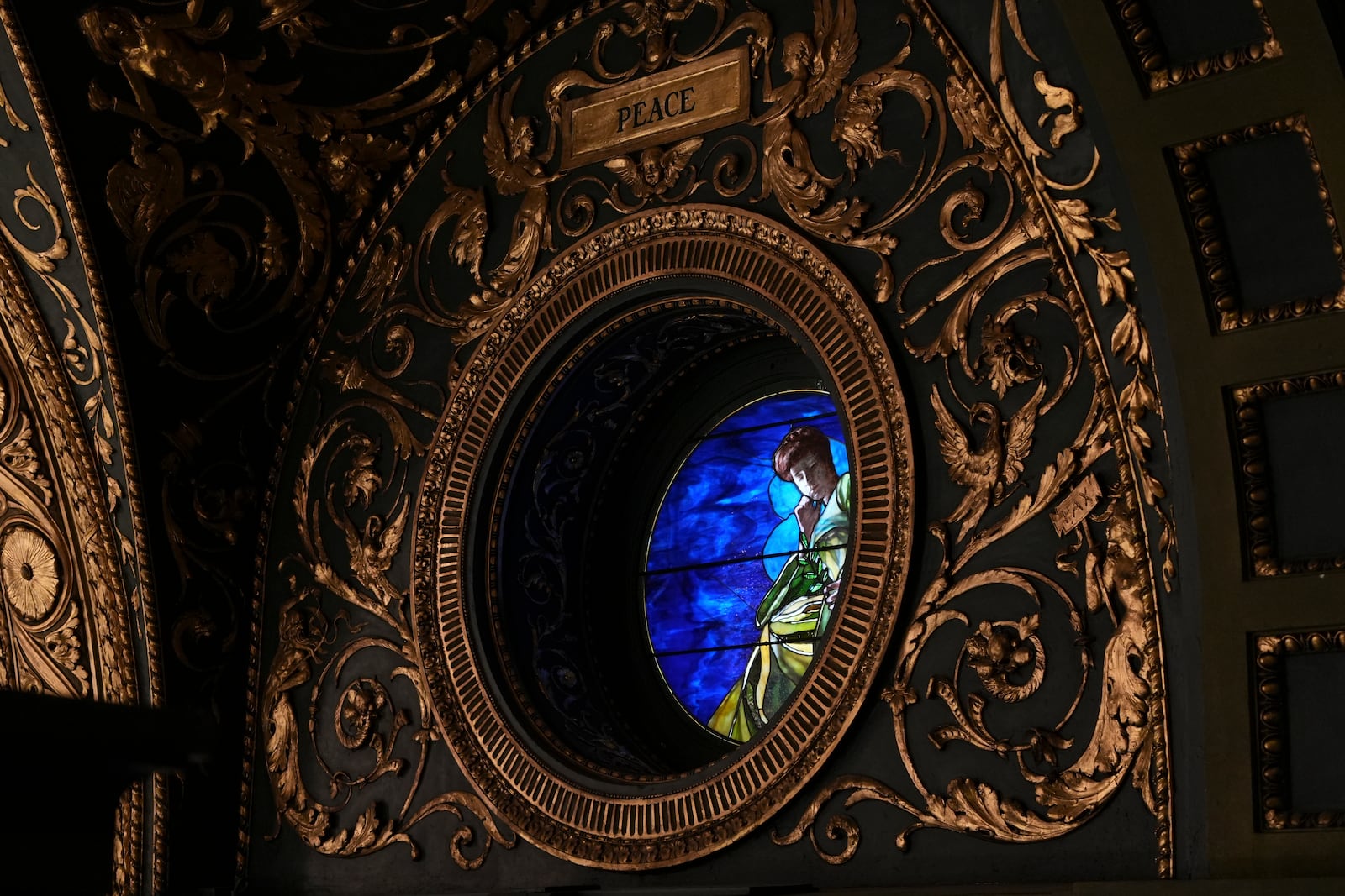 Sunlight shines through a stained-glass window at the Pennsylvania Capitol in Harrisburg, Pa., on Sunday, Oct. 27, 2024. (AP Photo/Luis Andres Henao)