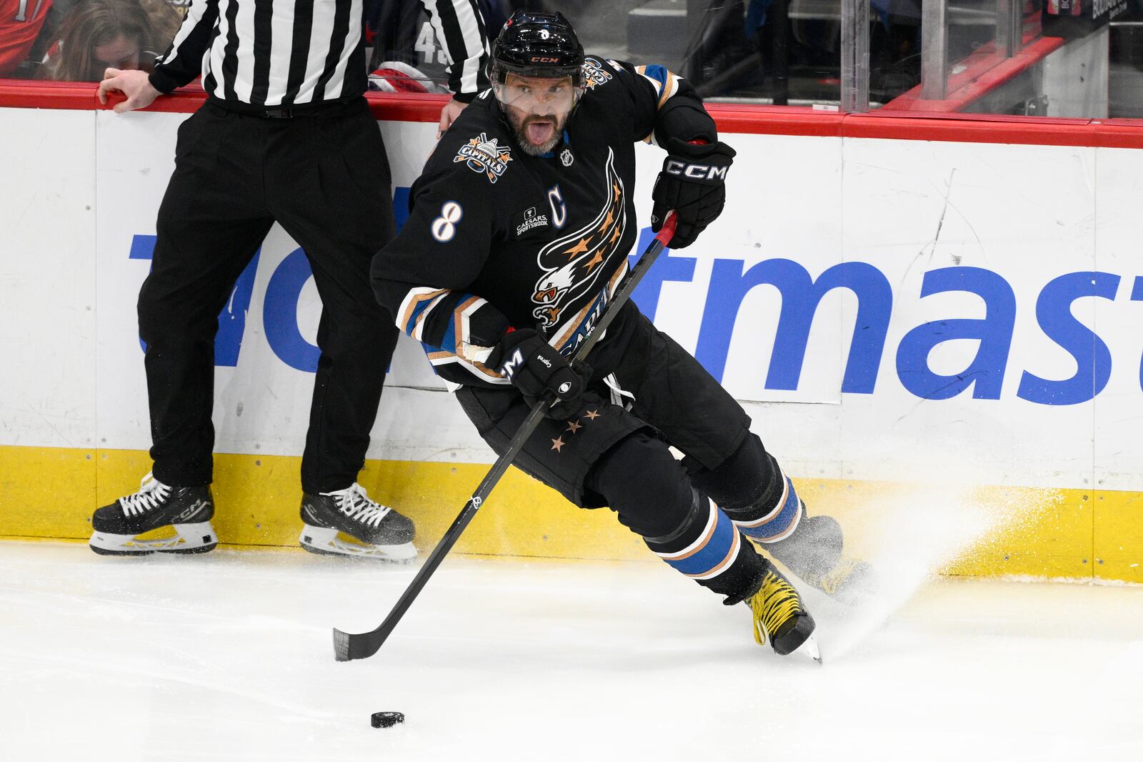 Washington Capitals left wing Alex Ovechkin (8) skates with the puck during the third period of an NHL hockey game against the Winnipeg Jets, Saturday, Feb. 1, 2025, in Washington. (AP Photo/Nick Wass)