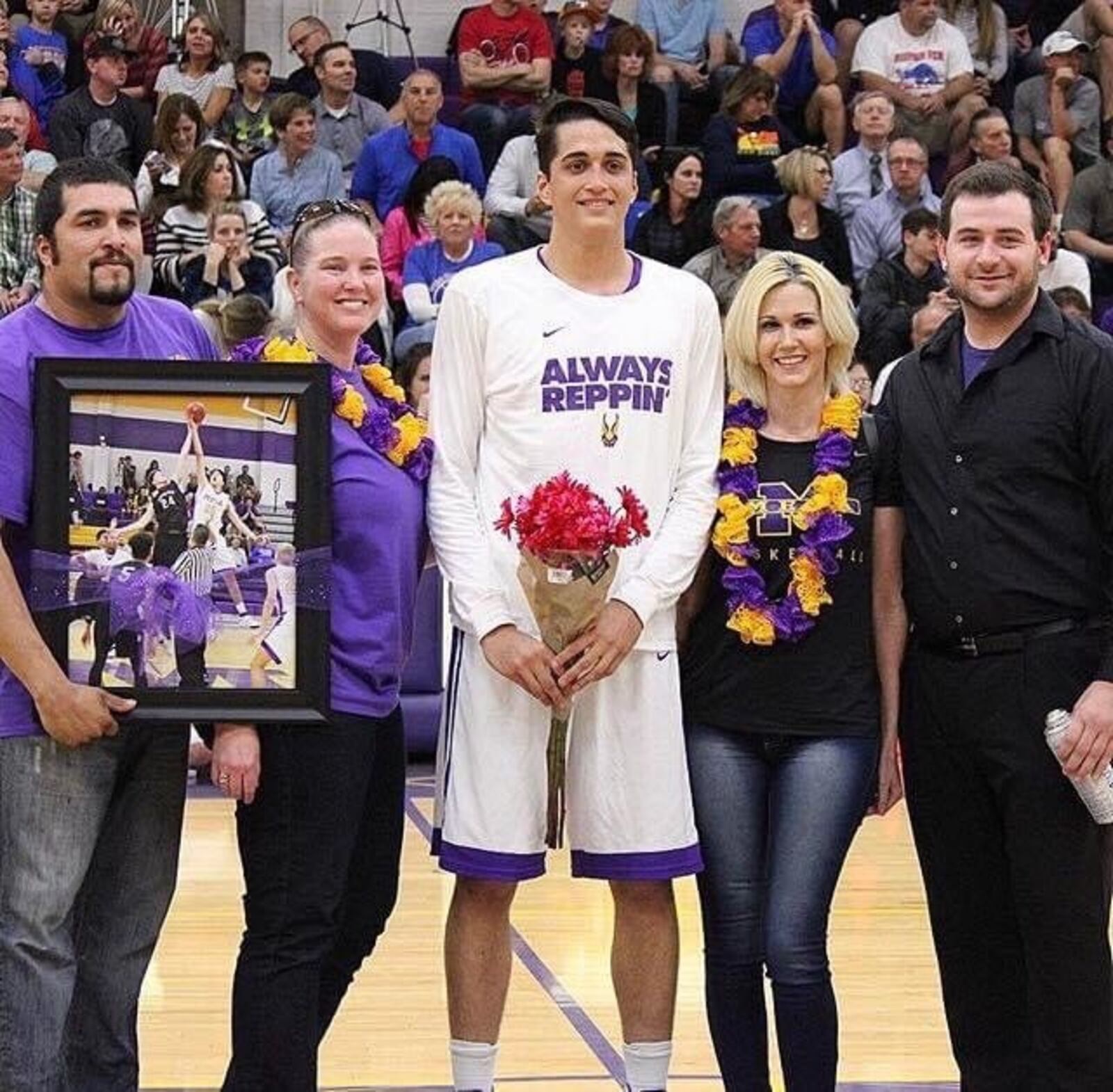 Antonio Barraza with his family at Senior Night for his  Mesa High basketball team in Arizona. (Left to right) Javier Barraza (his dad), Shauna Barraza Wampler (stepmom), Antonio Barraza, Lana Goth (mom), Patrick Goth (stepdad). CONTRIBUTED