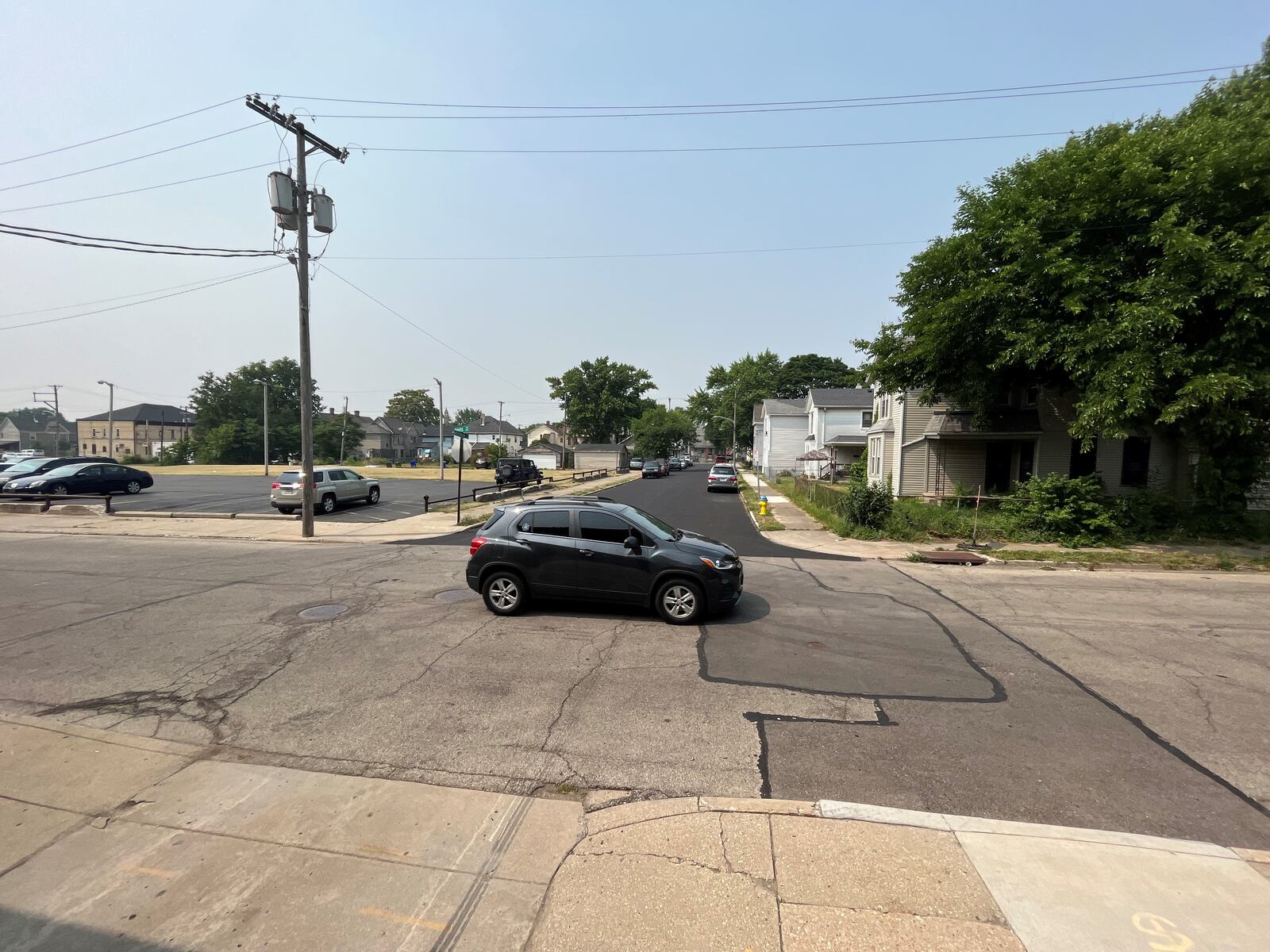 A car on Davis Avenue drives by Meridian Street in the Burkhardt neighborhood in East Dayton. CORNELIUS FROLIK / STAFF