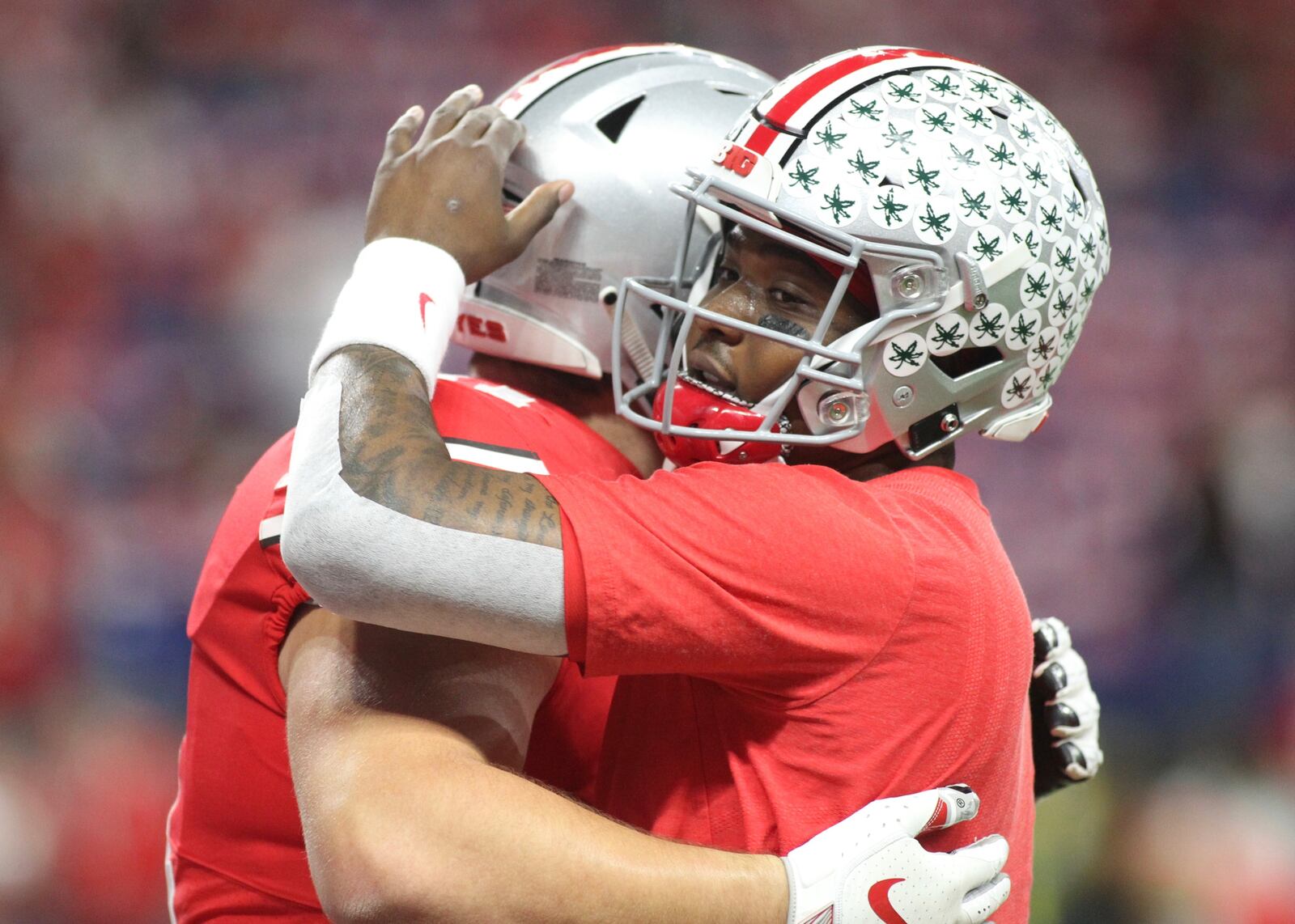 Ohio State’s Dwayne Haskins, right, hugs Josh Myers before the Big Ten Championship on Saturday, Dec. 1, 2018, at Lucas Oil Stadium in Indianapolis.