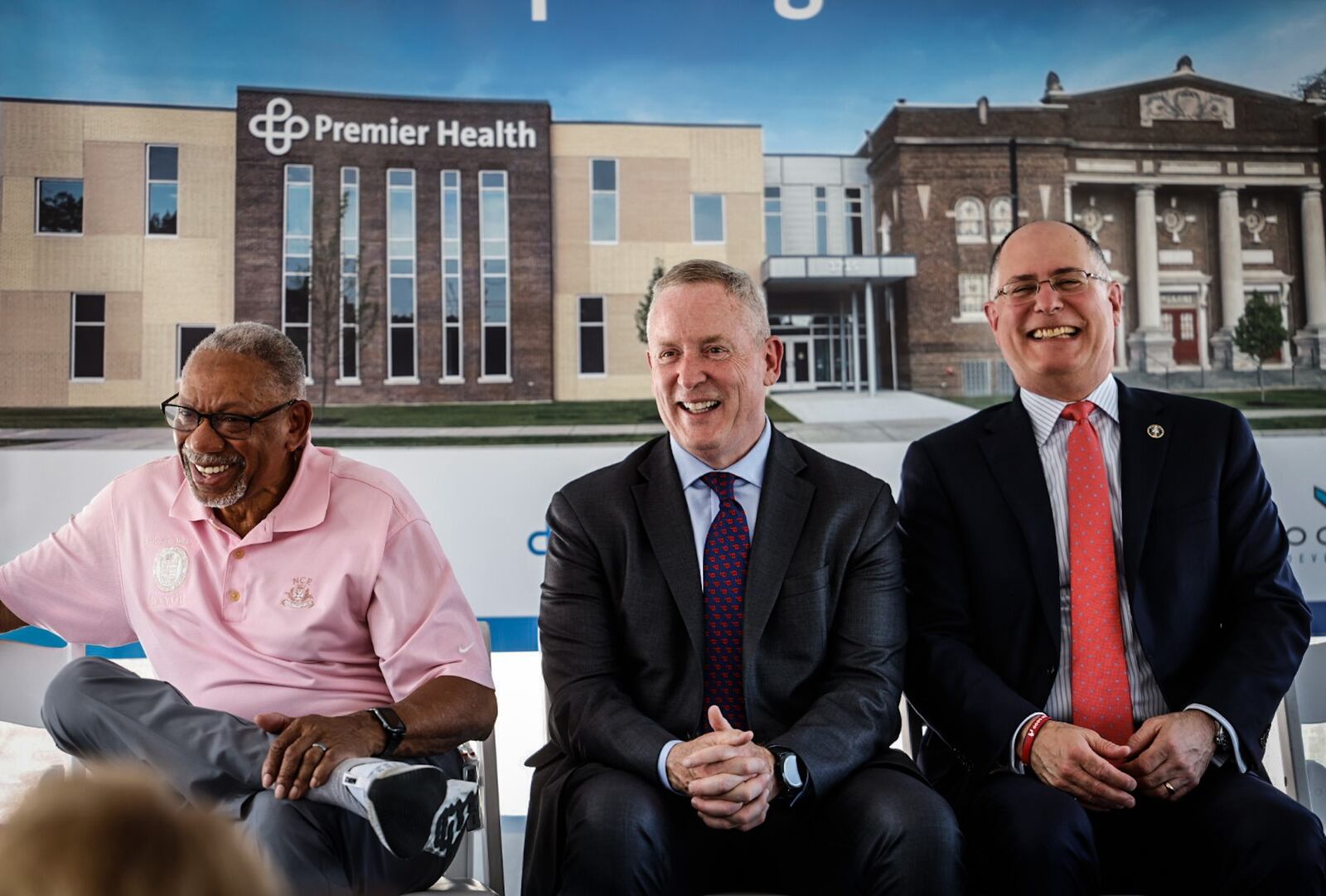 Dayton Mayor, Jeff Mims, left President & CEO of Premier Health, Mike Riordan, middle and President of the University of Dayton, Eric Spina celebrates the grand opening of a new medical office building on Brown Street Thursday June 1, 2023. The building is a marriage of the old South Park Methodist church and a new building. JIM NOELKER/STAFF