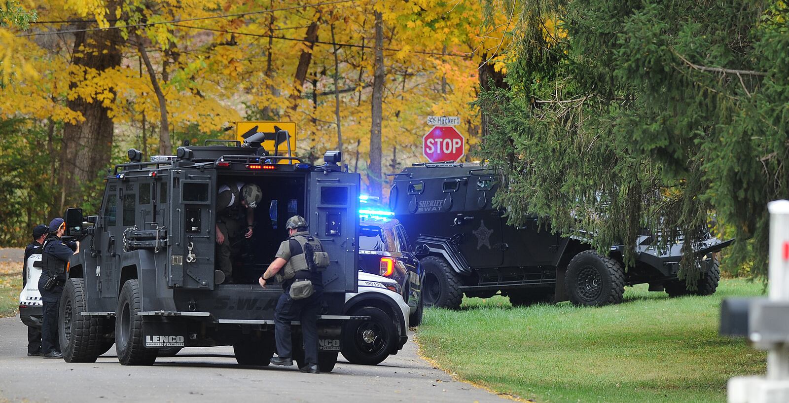 Multiple SWAT and police crews were on the scene of an investigation on Hacker Road in Clayton on Thursday, Oct. 26, 2023. Dayton and Trotwood police, as well as the Montgomery County Sheriff's Office were among crews on the scene. MARSHALL GORBY / STAFF