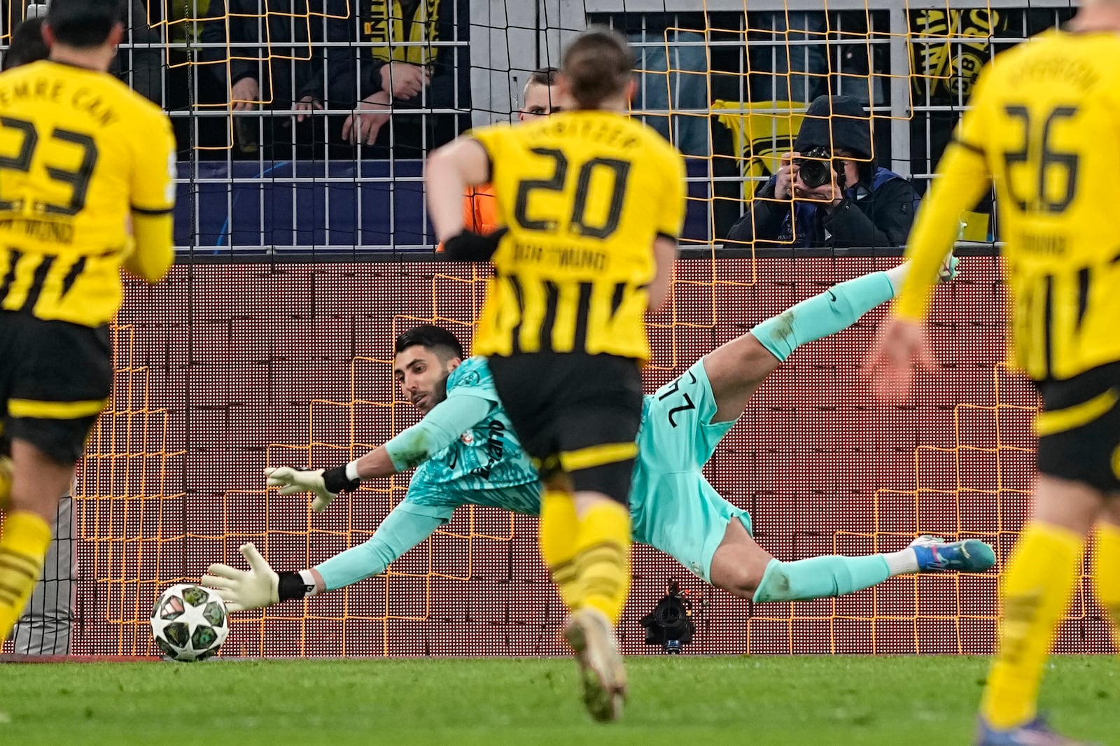 Sporting's goalkeeper Rui Silva saves the penalty kick during the Champions League playoff second leg soccer match between Borussia Dortmund and Sporting CP at the Signa-Iduna Park in Dortmund, Germany, Wednesday, Feb. 19, 2025. (AP Photo/Martin Meissner)