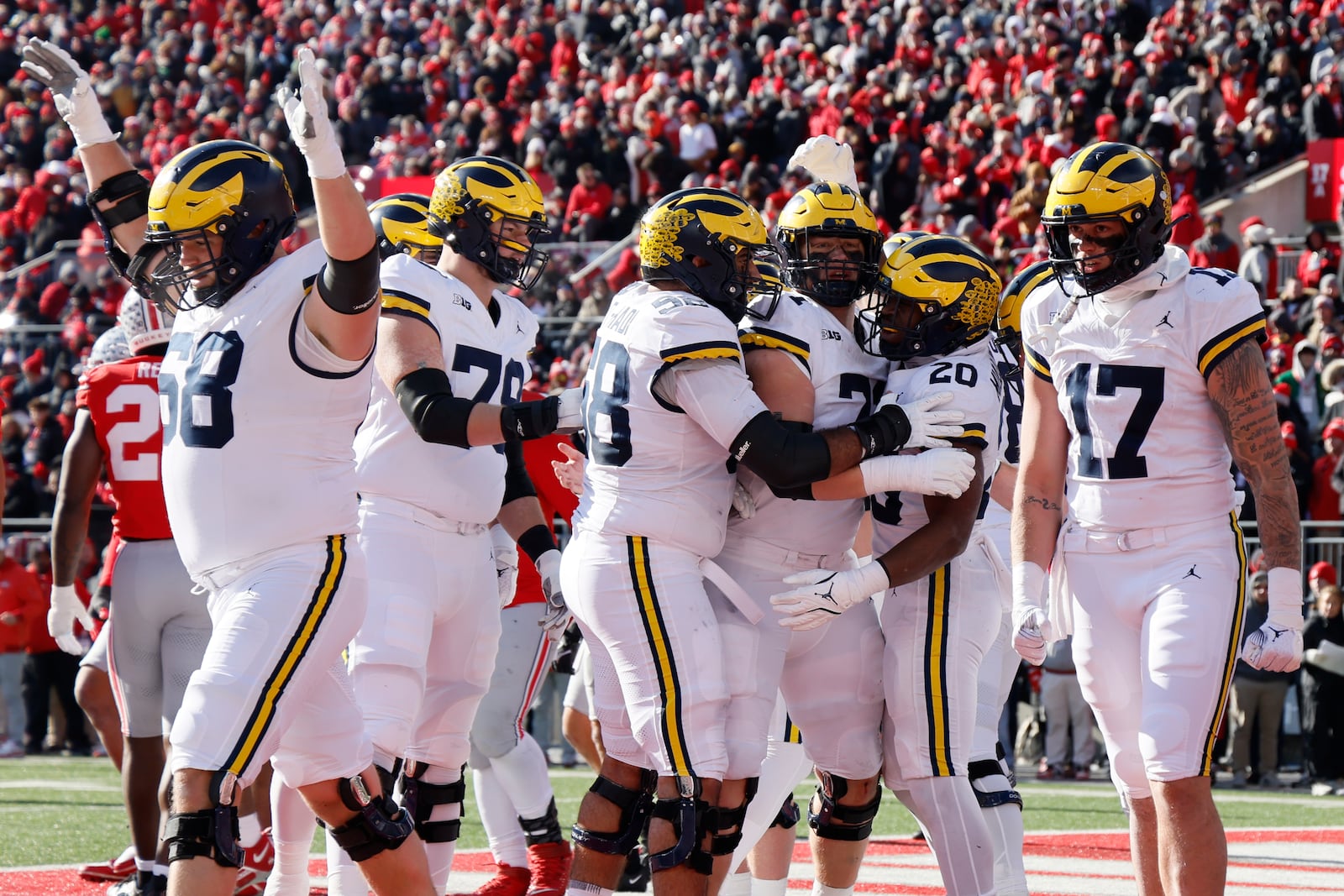 Michigan players celebrate their touchdown against Ohio State during the first half of an NCAA college football game Saturday, Nov. 30, 2024, in Columbus, Ohio. (AP Photo/Jay LaPrete)