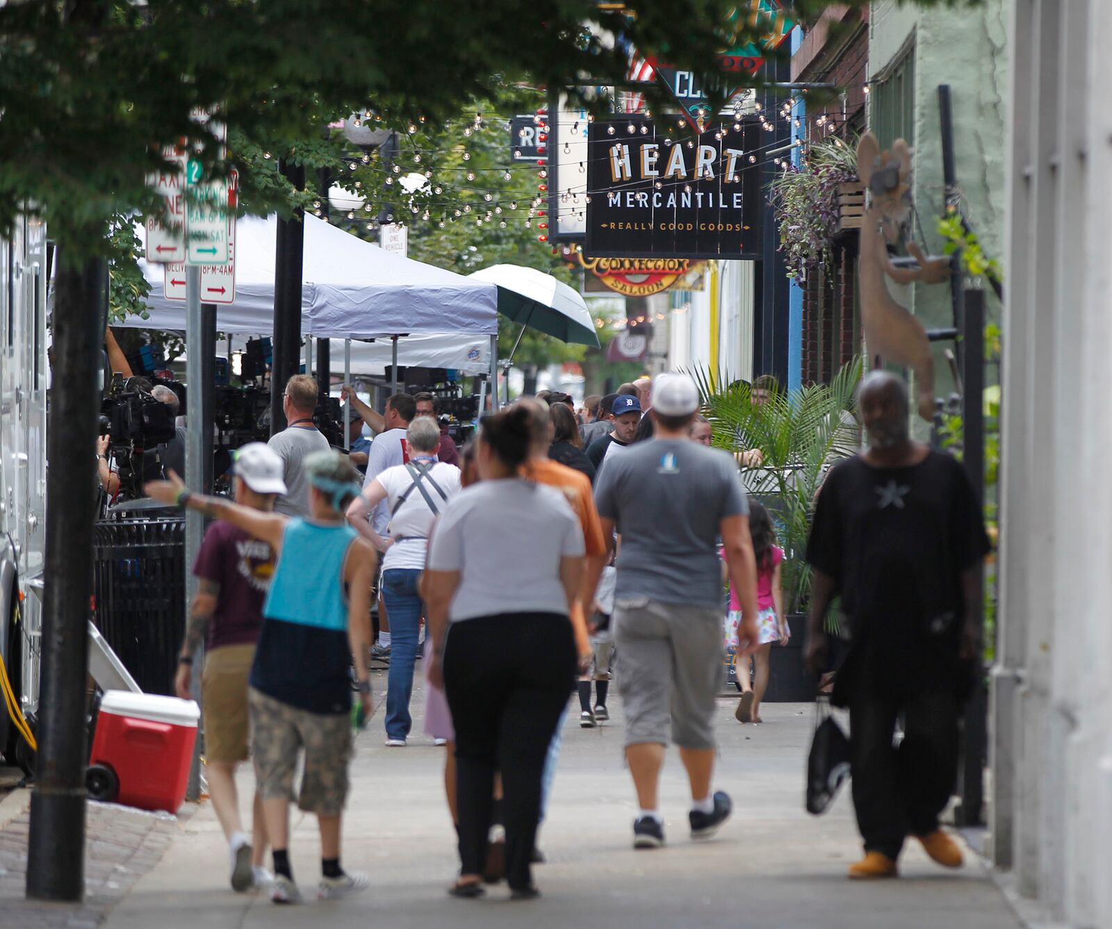 The Oregon District was busy on Monday after a mass shooting early Sunday morning left shop, restaurant and bar owners and residents shocked.  TY GREENLEES / STAFF