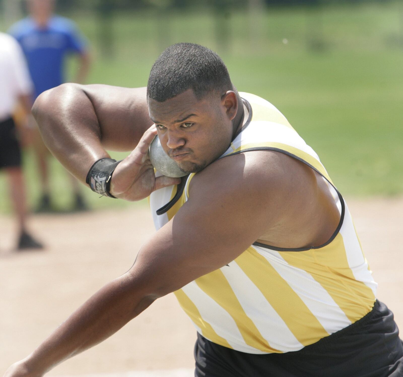 June 4, 2011. Michael Bennett, a Centerville senior, on this throw, throws the shot put 63ft 11 inches. winning the Division I event.