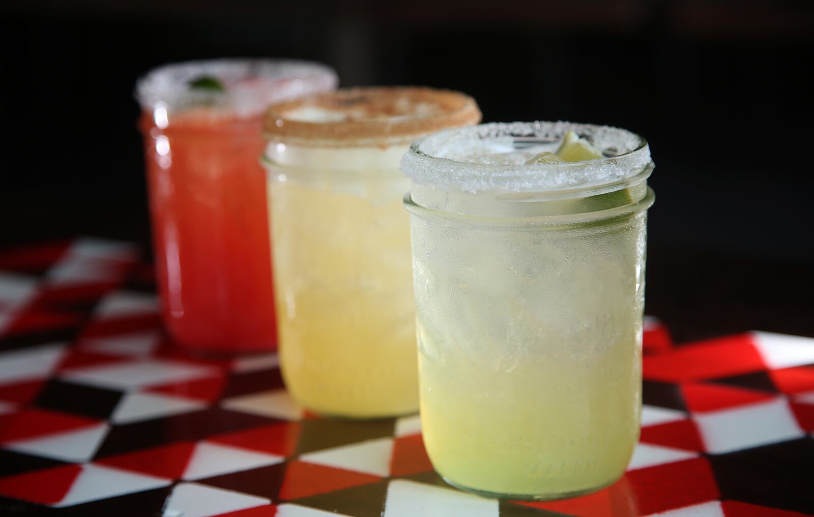 A blood orange house margarita, a sparkling margarita and a Pineapple Express margarita are among the drinks that can be found at Condado Tacos at the Greene. FILE