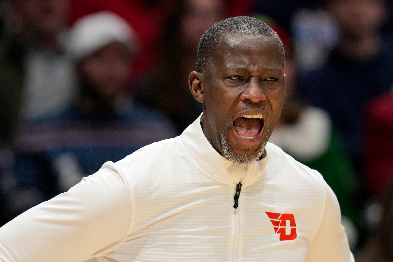 Dayton coach Anthony Grant shouts during the first half of an NCAA college basketball game against UNLV, Tuesday, Dec. 17, 2024, in Dayton, Ohio. (AP Photo/Jeff Dean)