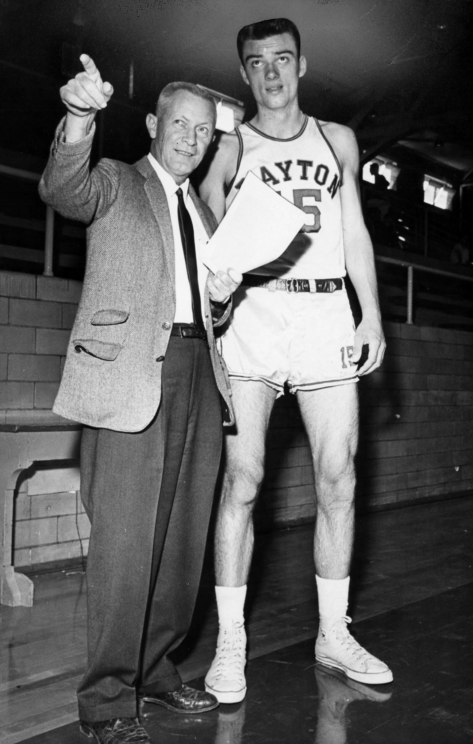 Sophomore Hank Finkel of University of Dayton with UD basketball Coach Tom Blackburn during the 1963-64 season. DAYTON DAILY NEWS ARCHIVE